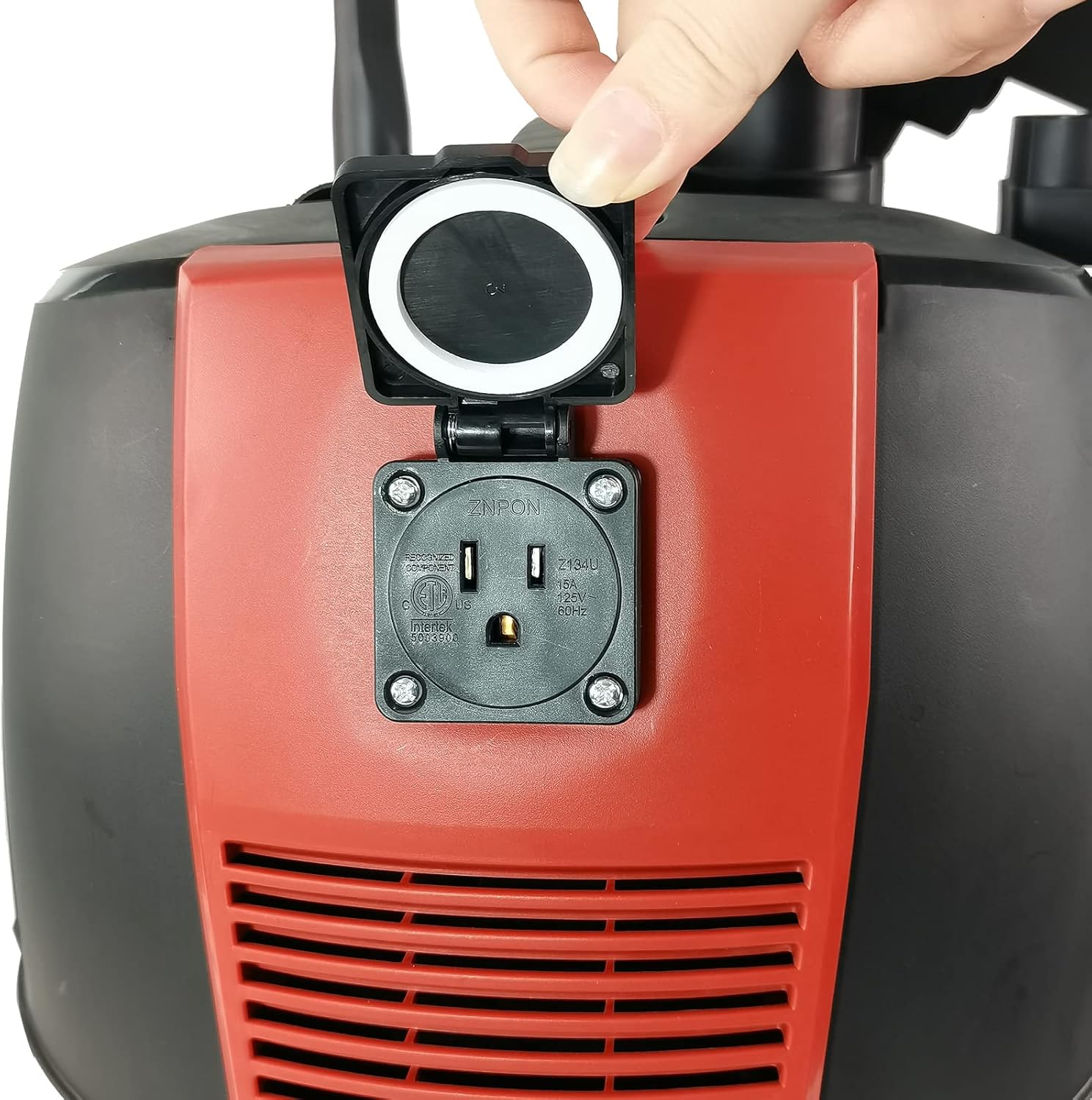 A hand opening the protective cover of the power tool socket on the dust extractor