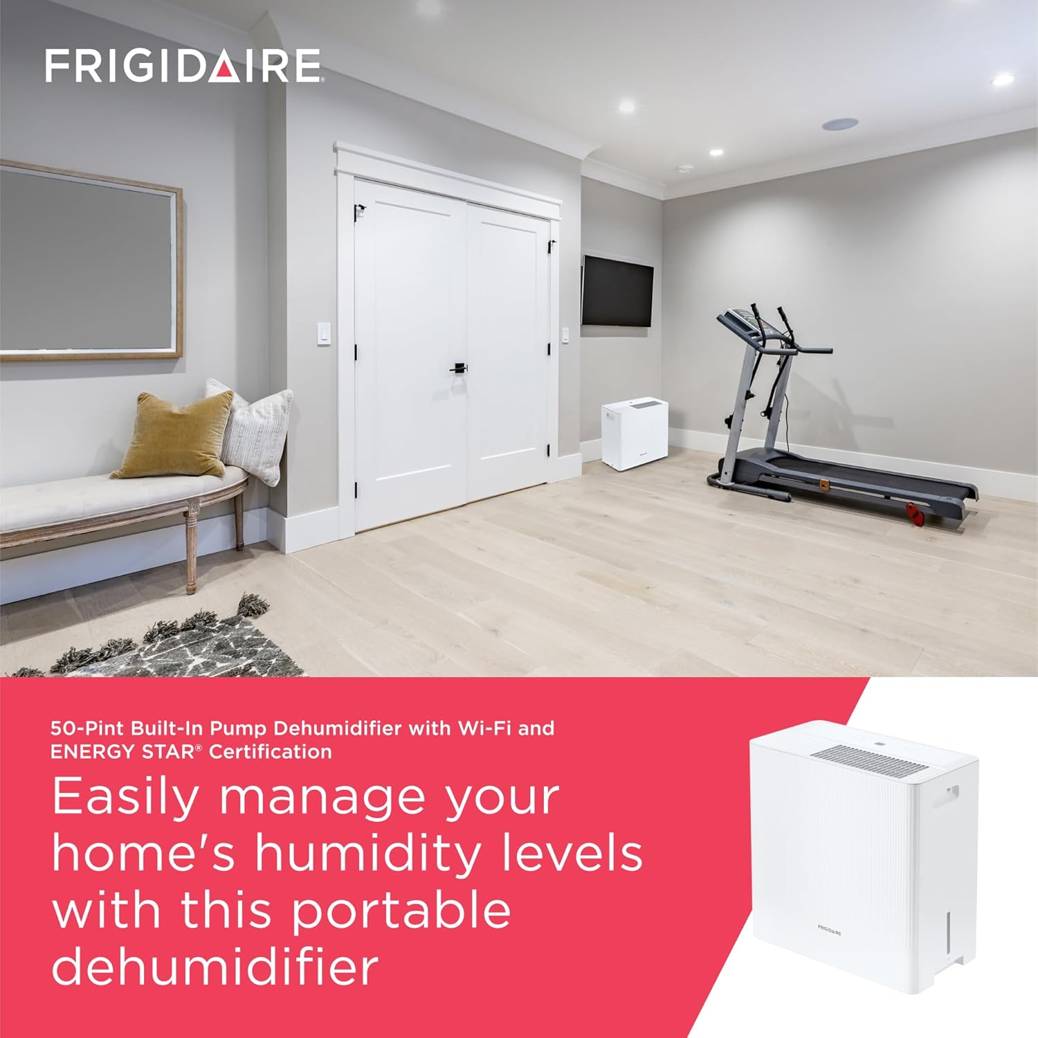 Frigidaire 50-Pint Portable Dehumidifier placed in a modern basement living area.