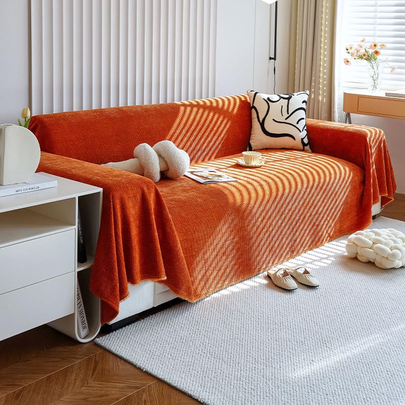 Housse de canapé sectionnel orange en chenille pour un salon cocooning et chaleureux