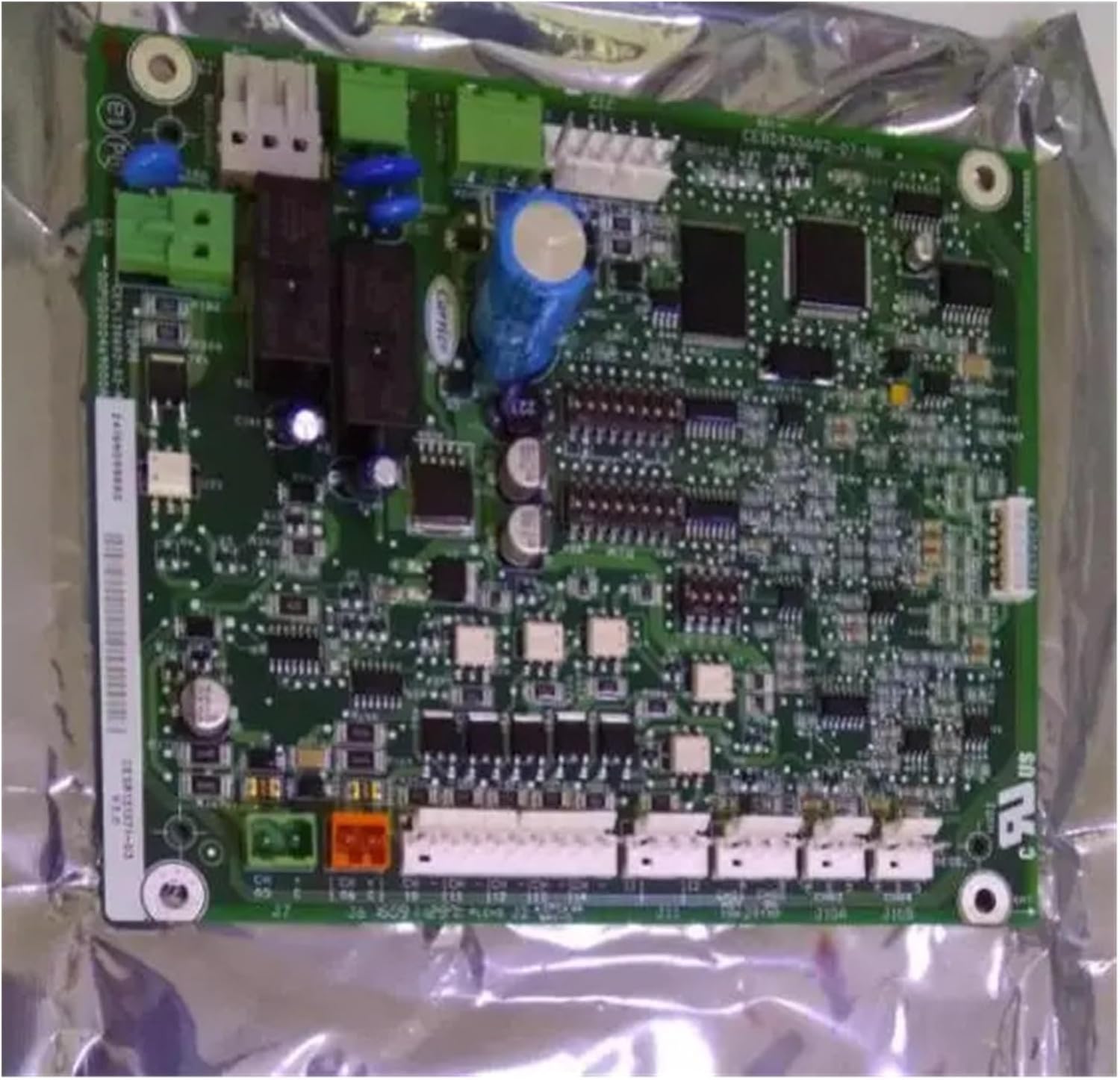 JYFORNWC Carrier Air Conditioner Motherboard packaged in anti-static material, showing the underside and components.