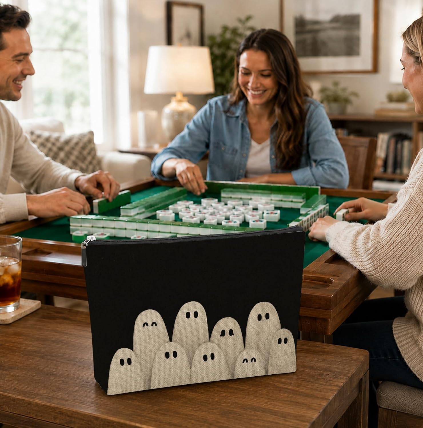 Friends playing Mahjong with the Halloween Mahjong Tile Bag - Ghost Crowd on the table