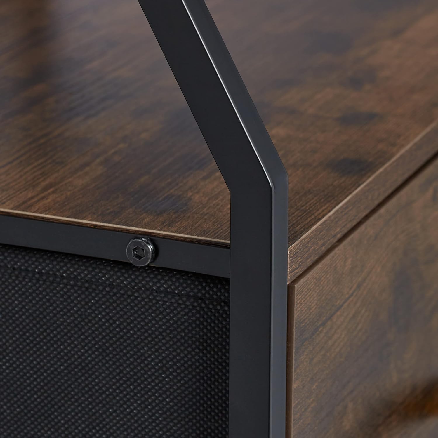 Close-up of the metal frame and wood-look panel connection on the Relaxdays TV cabinet.