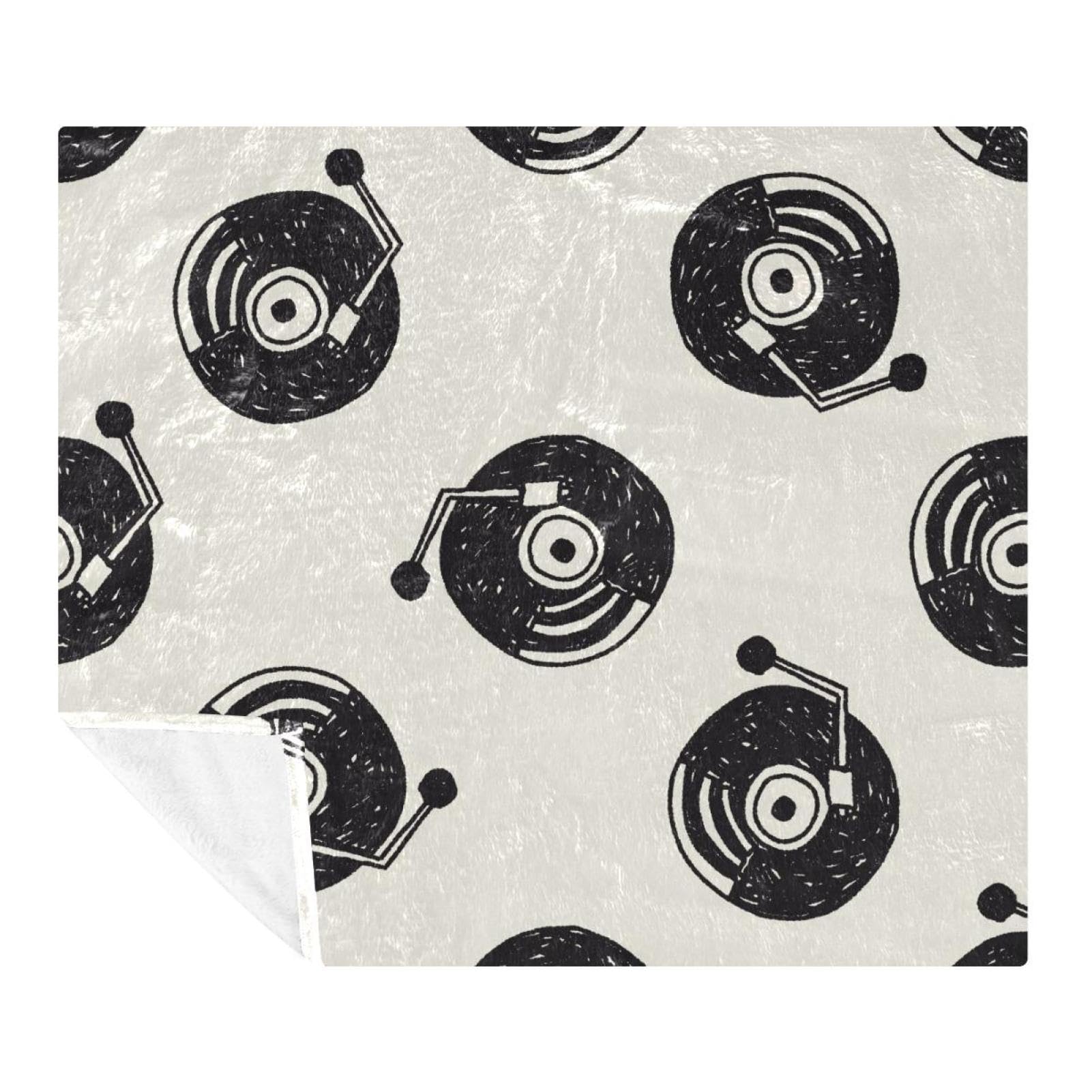Couverture douce motif musique pour cocooning sur canapé et lit