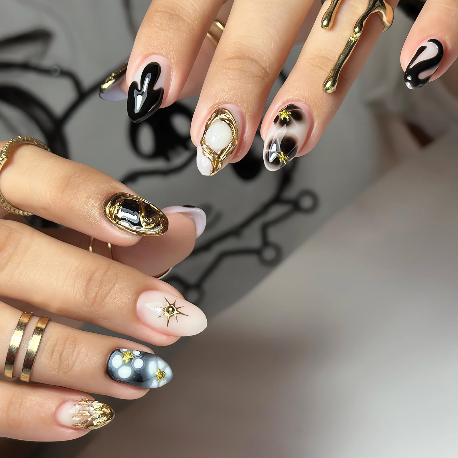 Stereoscopic Dark Totem Press on Nails Almond Fake Nails, LPOODDNU Black Gold Press on Nails Medium Length False Nail Tips with Star Designs Full