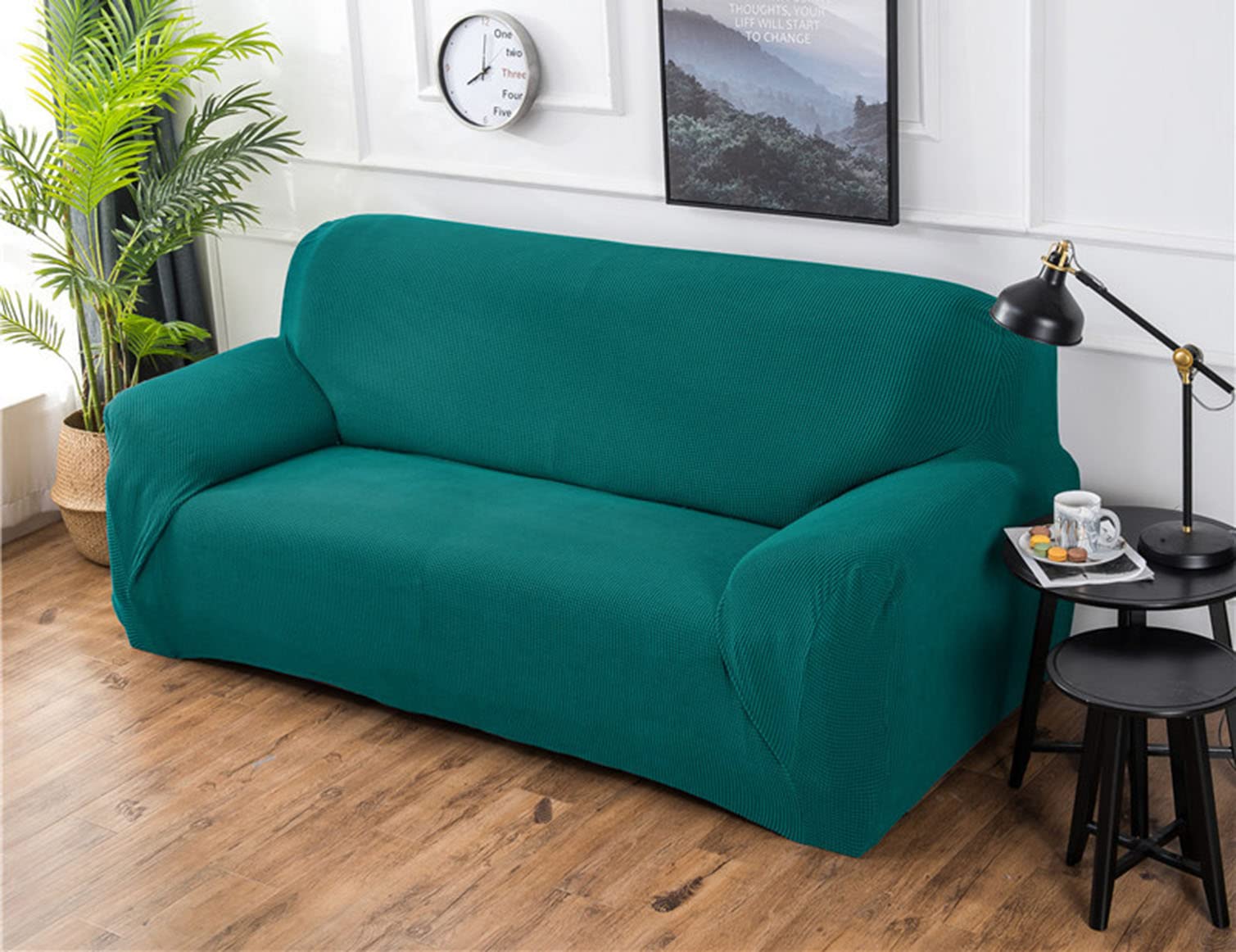 Housse de canapé extensible verte pour protéger votre salon des taches