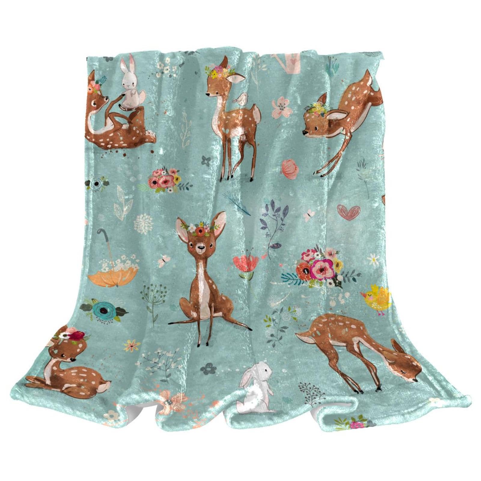 Plaid polaire cerf Sika contre le froid sur lit et divan
