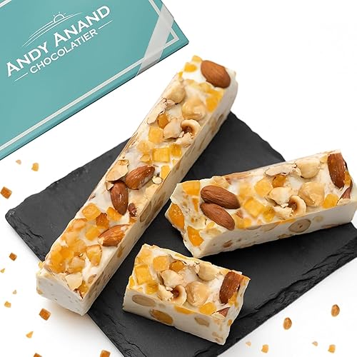 Andy Anand Chocolatier Caramelo de Turrón  Con cáscara de naranja suave y almendras tostadas y miel de flores silvestres de España  Aperitivo