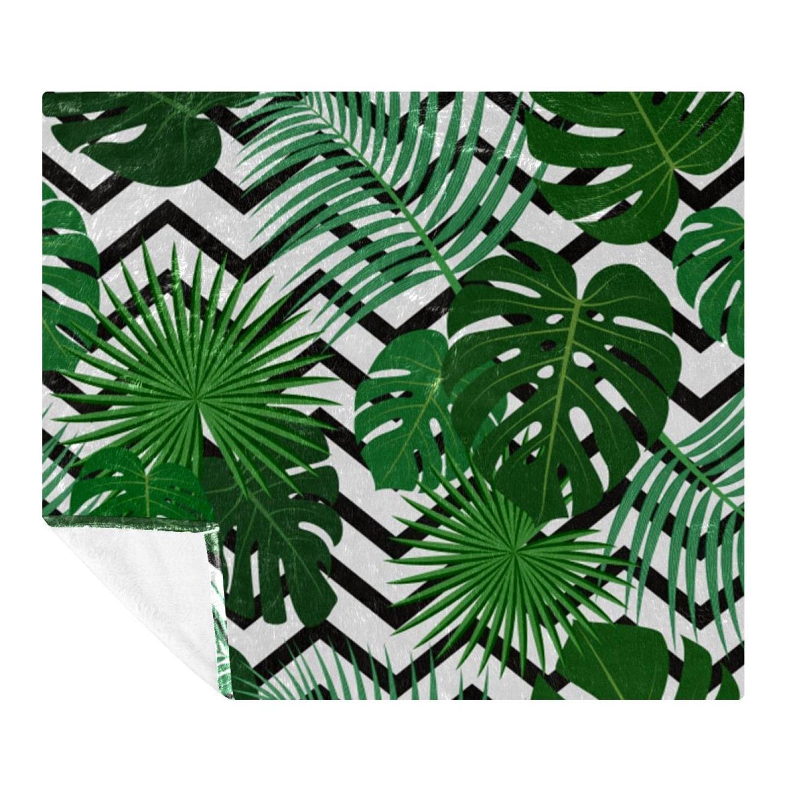 Couverture microfibre chevron noir et feuilles tropicales au fini soyeux