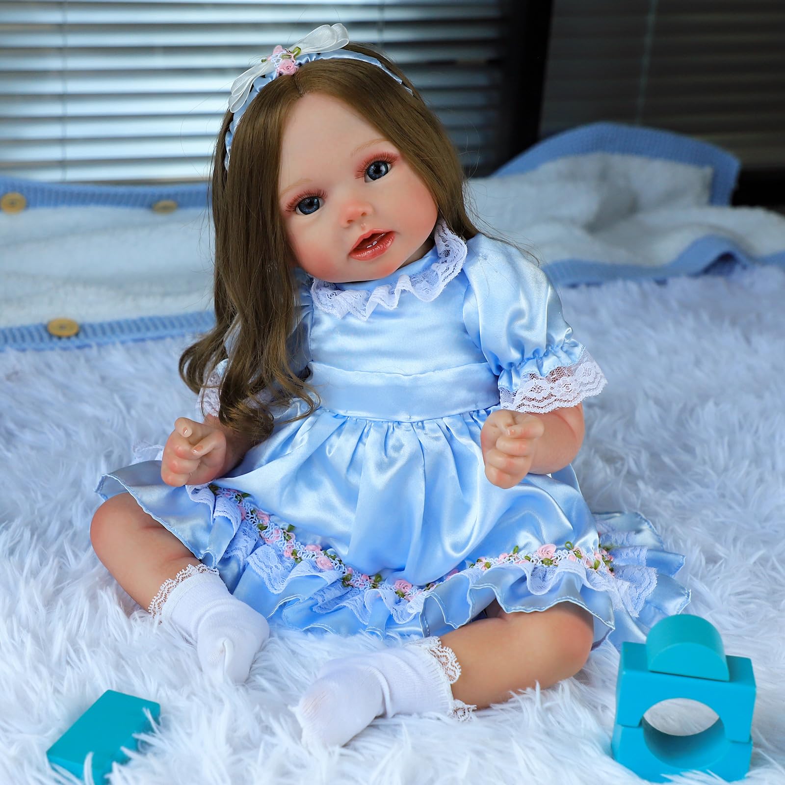COSYOVE Lifelike Reborn Baby Dolls - Stella 22 Inch Realistic Baby Doll Real Life Cloth Body Baby Dolls with Brown Hair Princess Toddler Dolls with Dress for Kids Age 3+