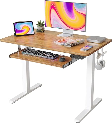 FEZIBO Escritorio de pie con bandeja para teclado, escritorio eléctrico de altura ajustable de 40 x 24 pulgadas, escritorio de pie para sentarse,