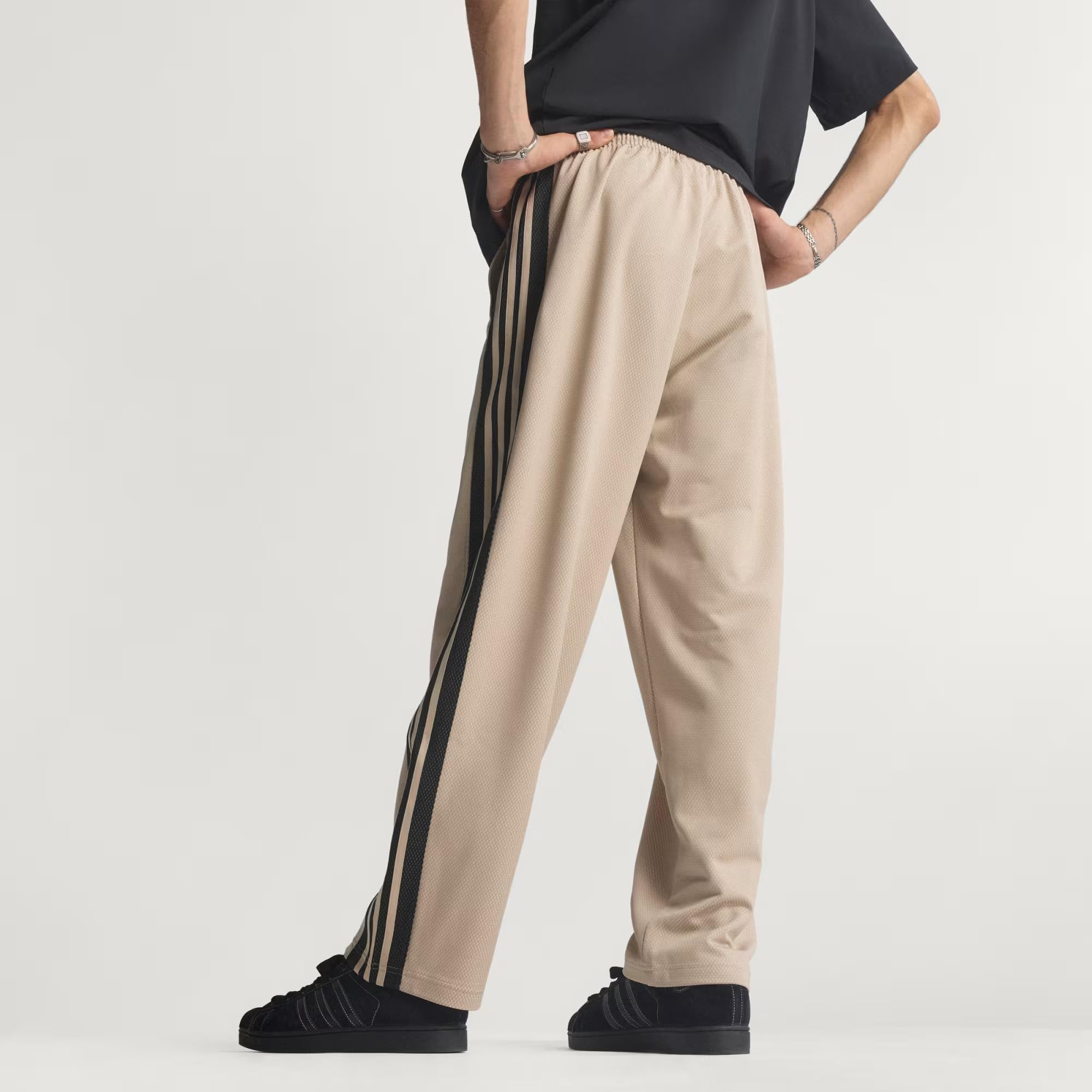 adidas Pantalones de chándal para hombre de malla holgada