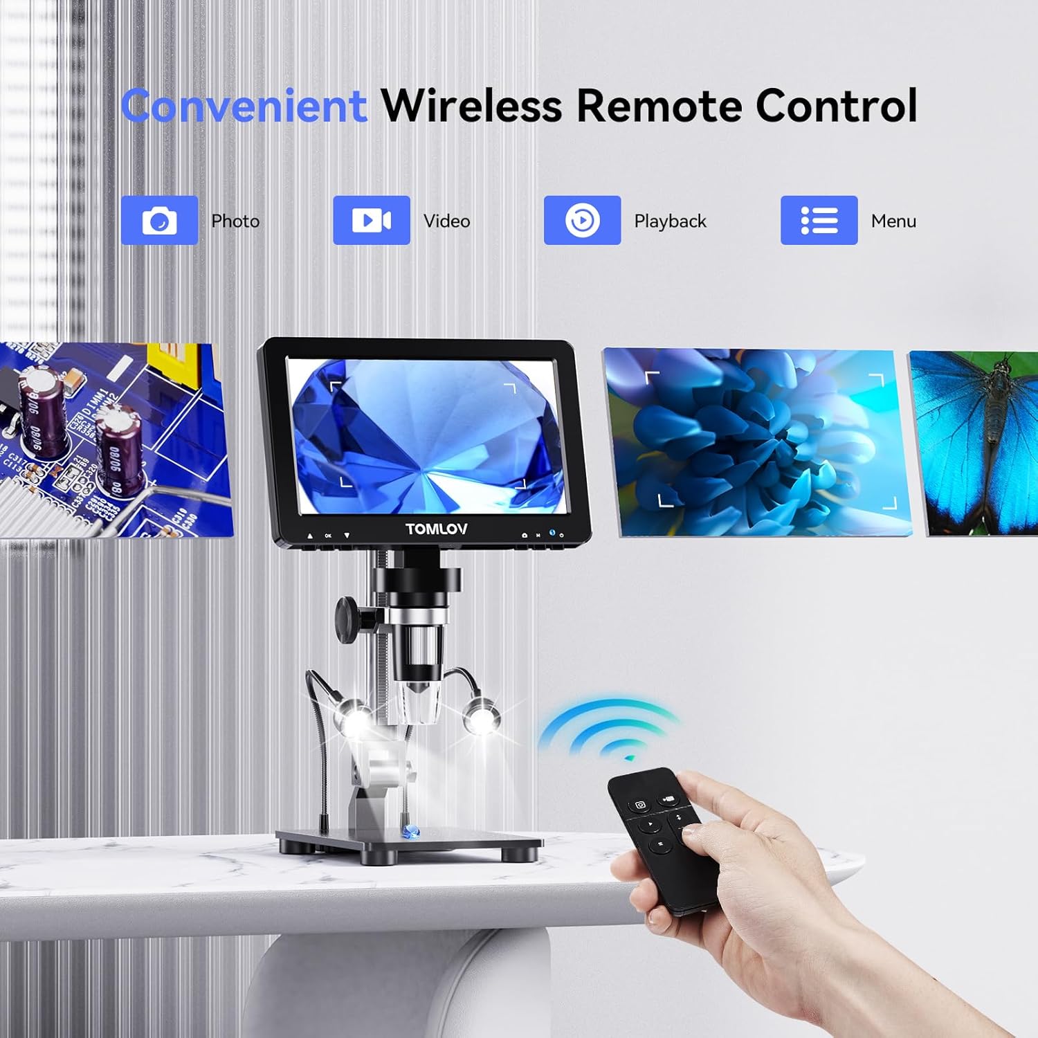 Hand holding the wireless remote control for the microscope