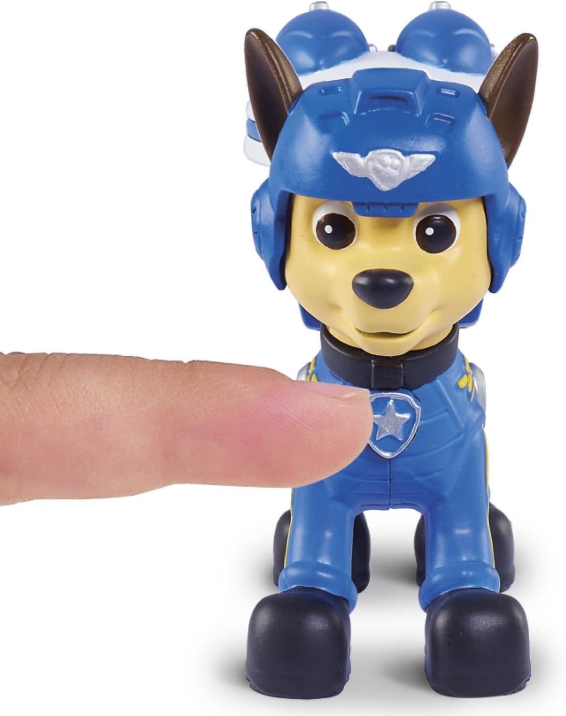 Finger pressing the button on Chase's pup pack to transform it