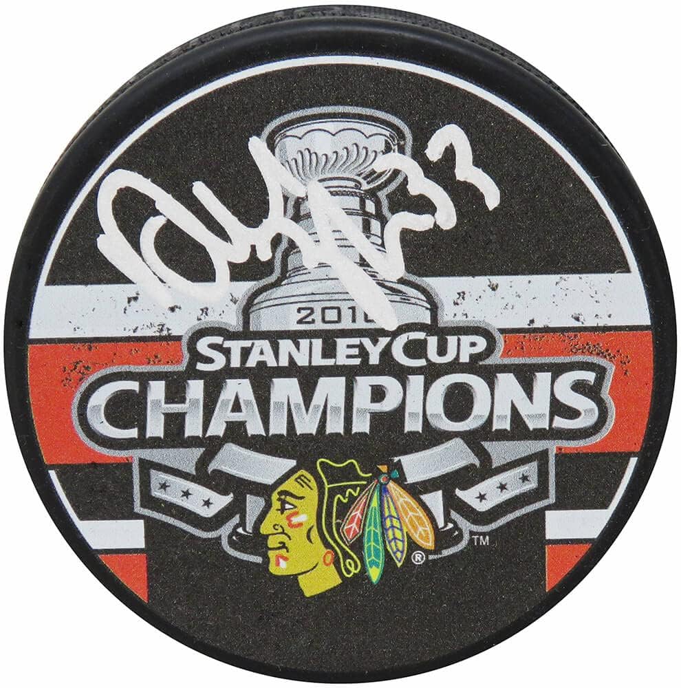 Dustin Byfuglien Signed Blackhawks 2010 Stanley Cup Champs Logo Hockey Puck - Schwartz Authenticated