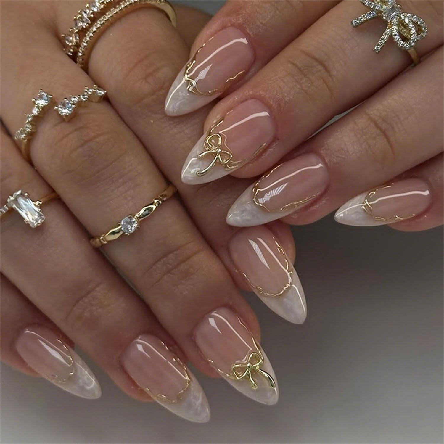 Photo 1 of 24pcs White French Tip Press on Nails Medium Almond Fake Nails with 3D Bow Acrylic Nails Design Gold Line Stick on Nails French False Nails Kit Full Cover Glue on Nails for Women Nail Decoration