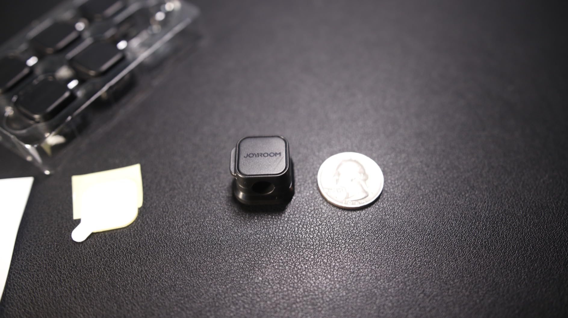 Cable clip size comparison next to a coin