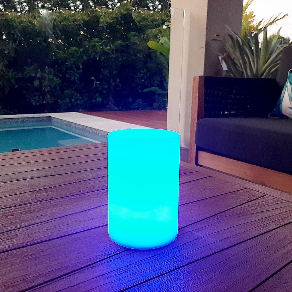 BYTECH Multi Color Cylinder Lamp glowing blue on a patio table