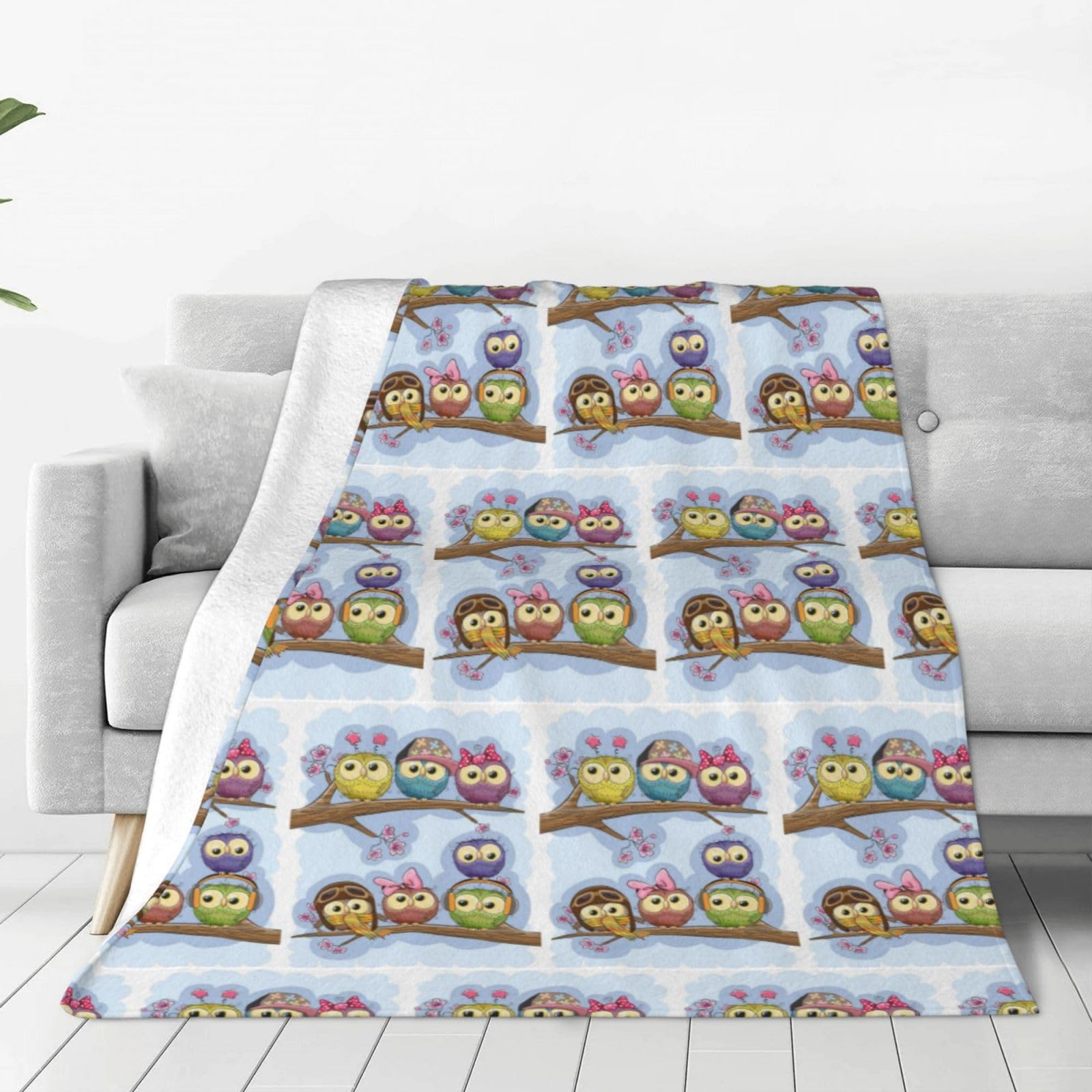 Couverture polaire chouettes : finissez-en avec le froid sur votre canapé !