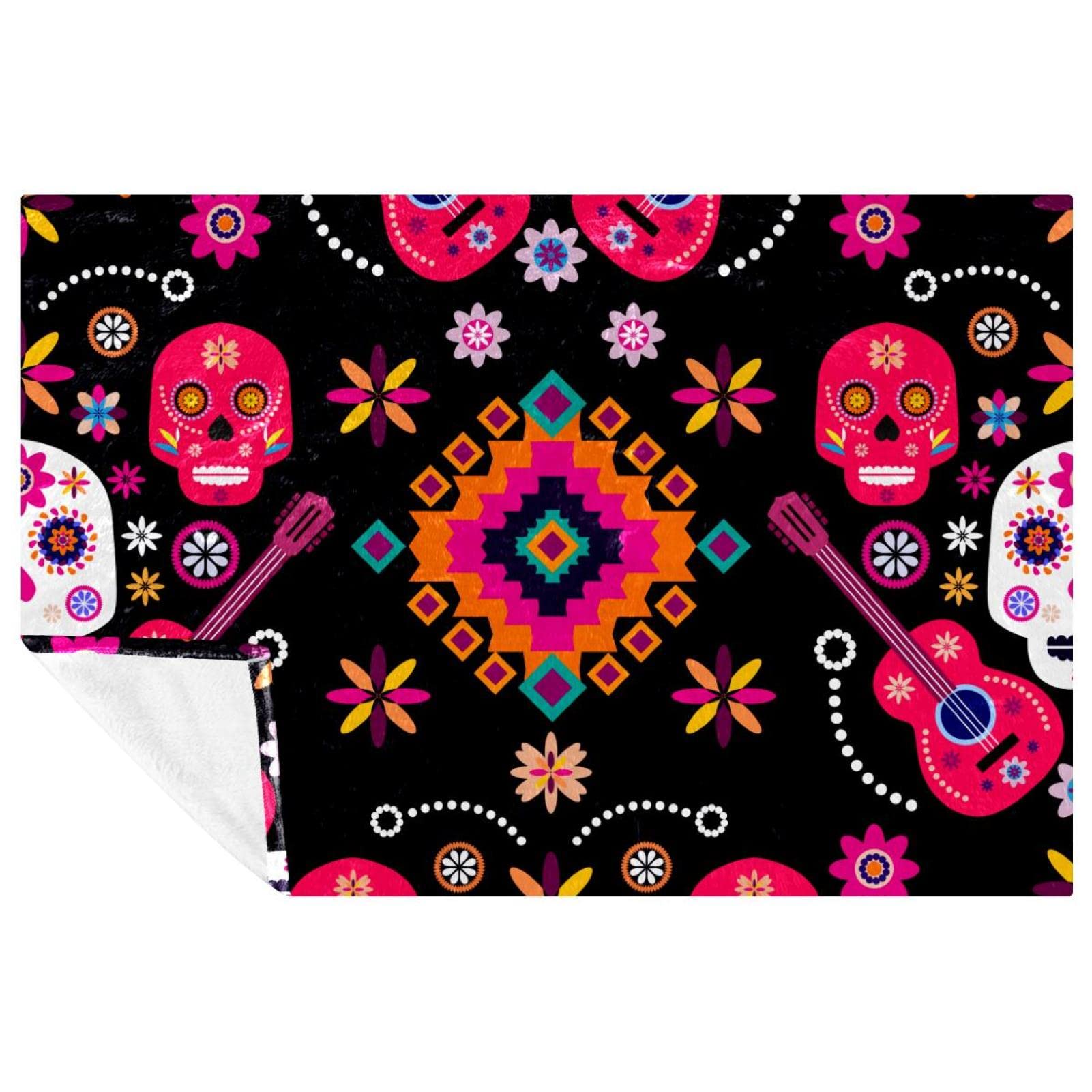 Couverture douce motif crânes en sucre et fleurs pour des moments cocooning