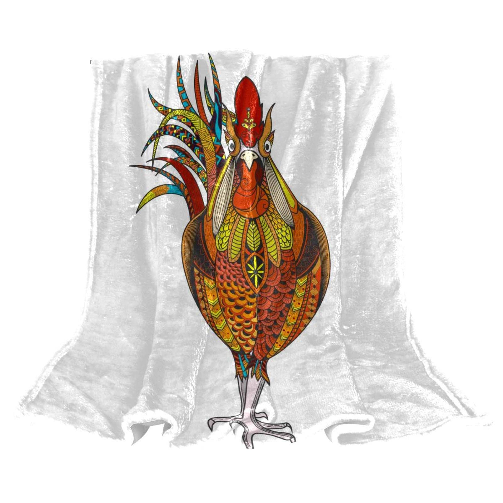 Couverture polaire légère coq pour cocooning sur le canapé du salon