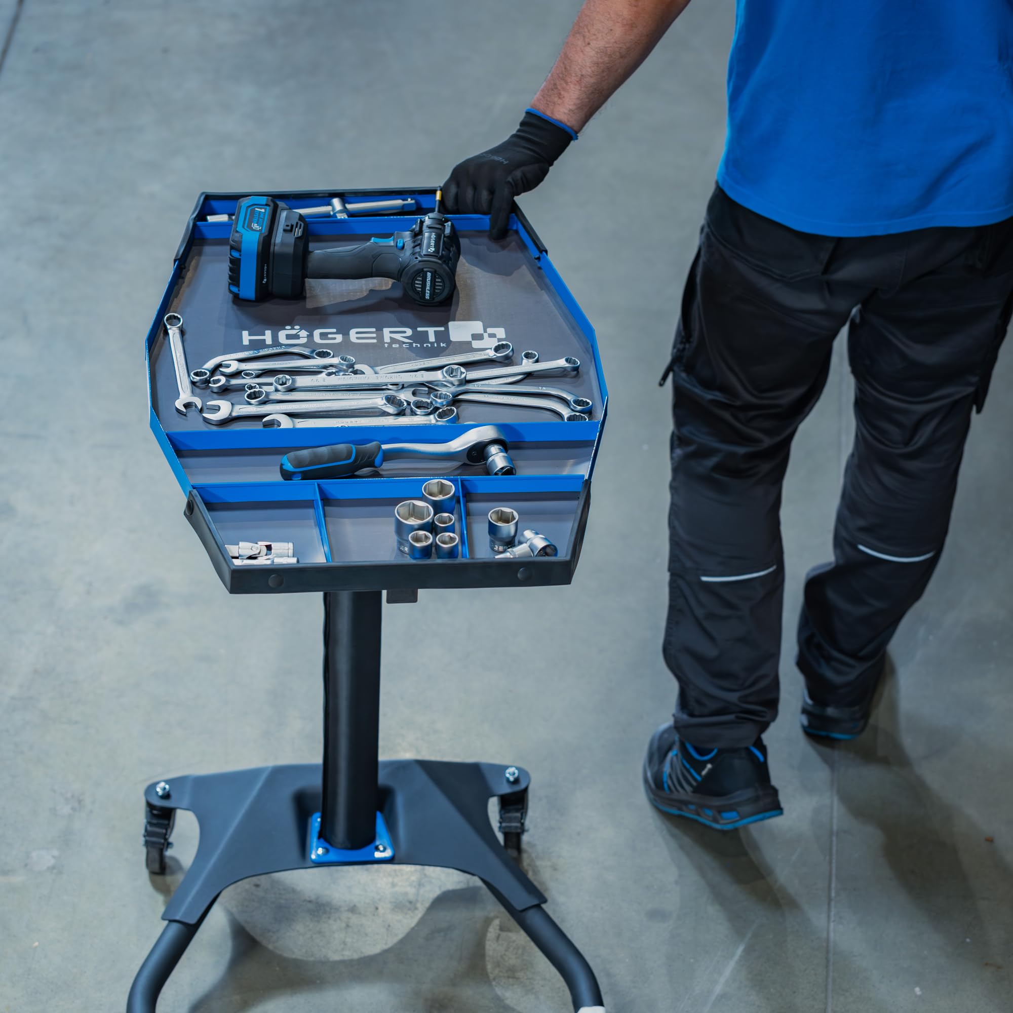 Högert Technik Mesa de Trabajo móvil HT7G564, Altura Regulable 86-120 cm, Capacidad 30 kg, Estructura en H para Taller, 4 Ruedas giratorias TPR con Freno, Azul-Negro