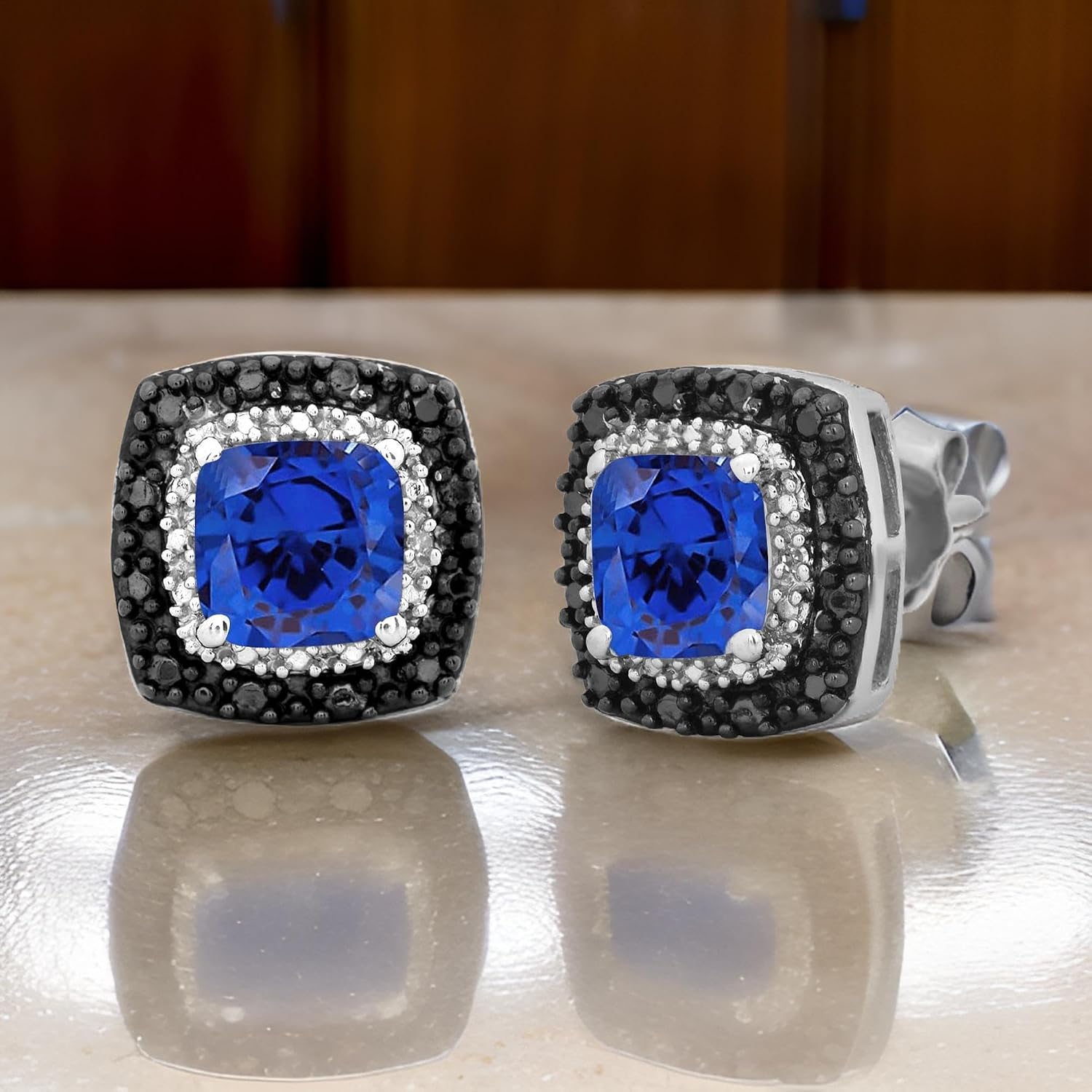 Jewelili Cushion Gem Stone with Black and White Diamonds Halo Stud Earrings in Sterling Silver. Choice of Ruby, Emerald, Blue Sapphire, Blue Topaz, Or Opal