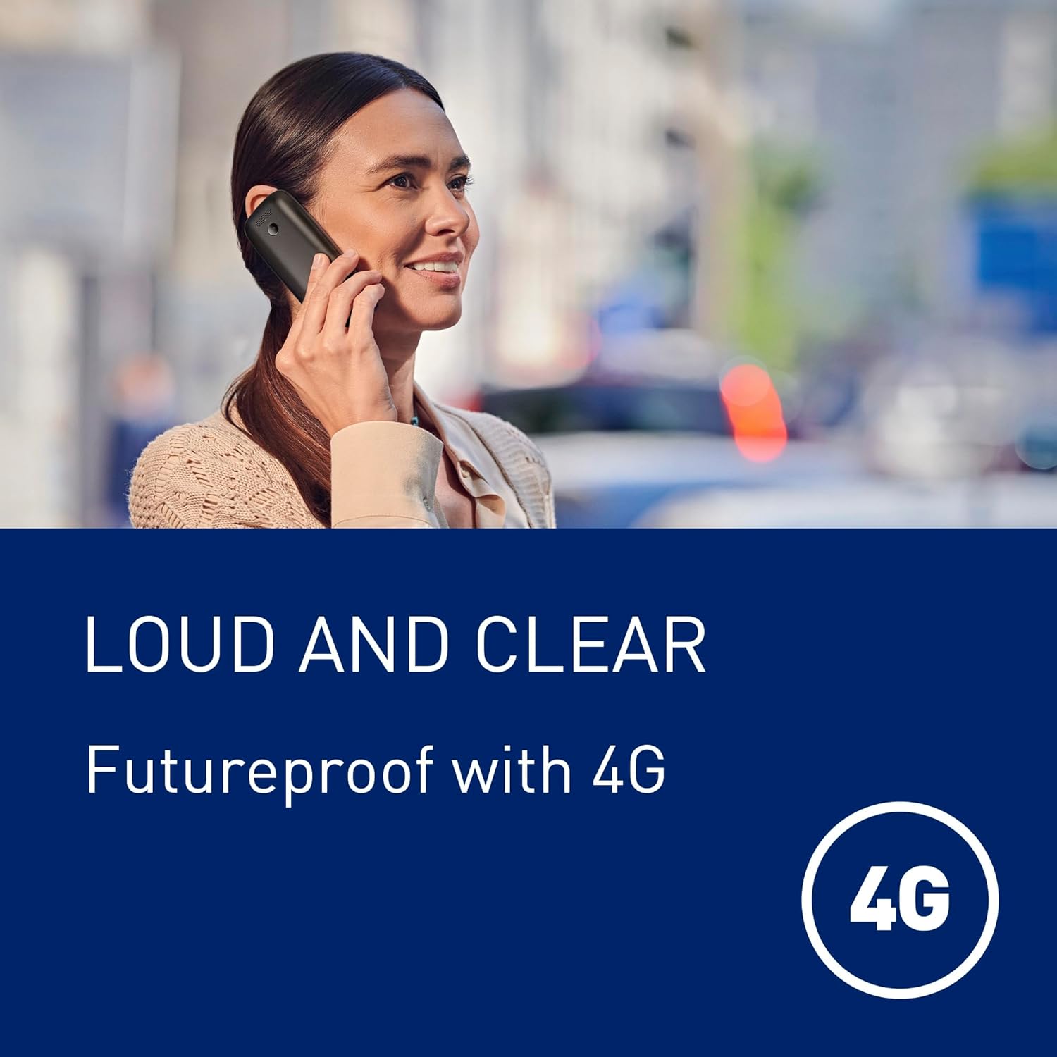 Person using the Panasonic KX-TF400EXB phone for a call in an outdoor setting.