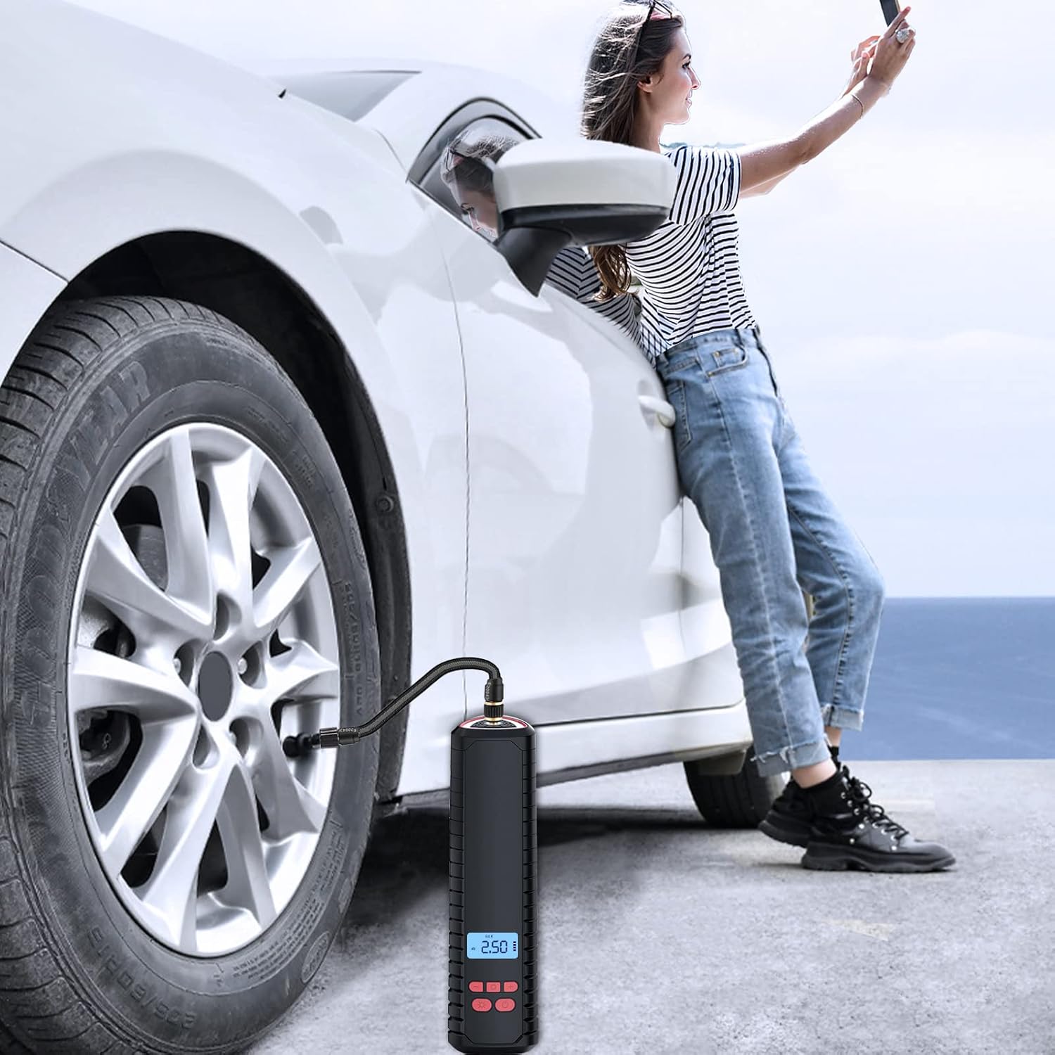 A person using the Neakhmer Portable Air Compressor to inflate a car tire.