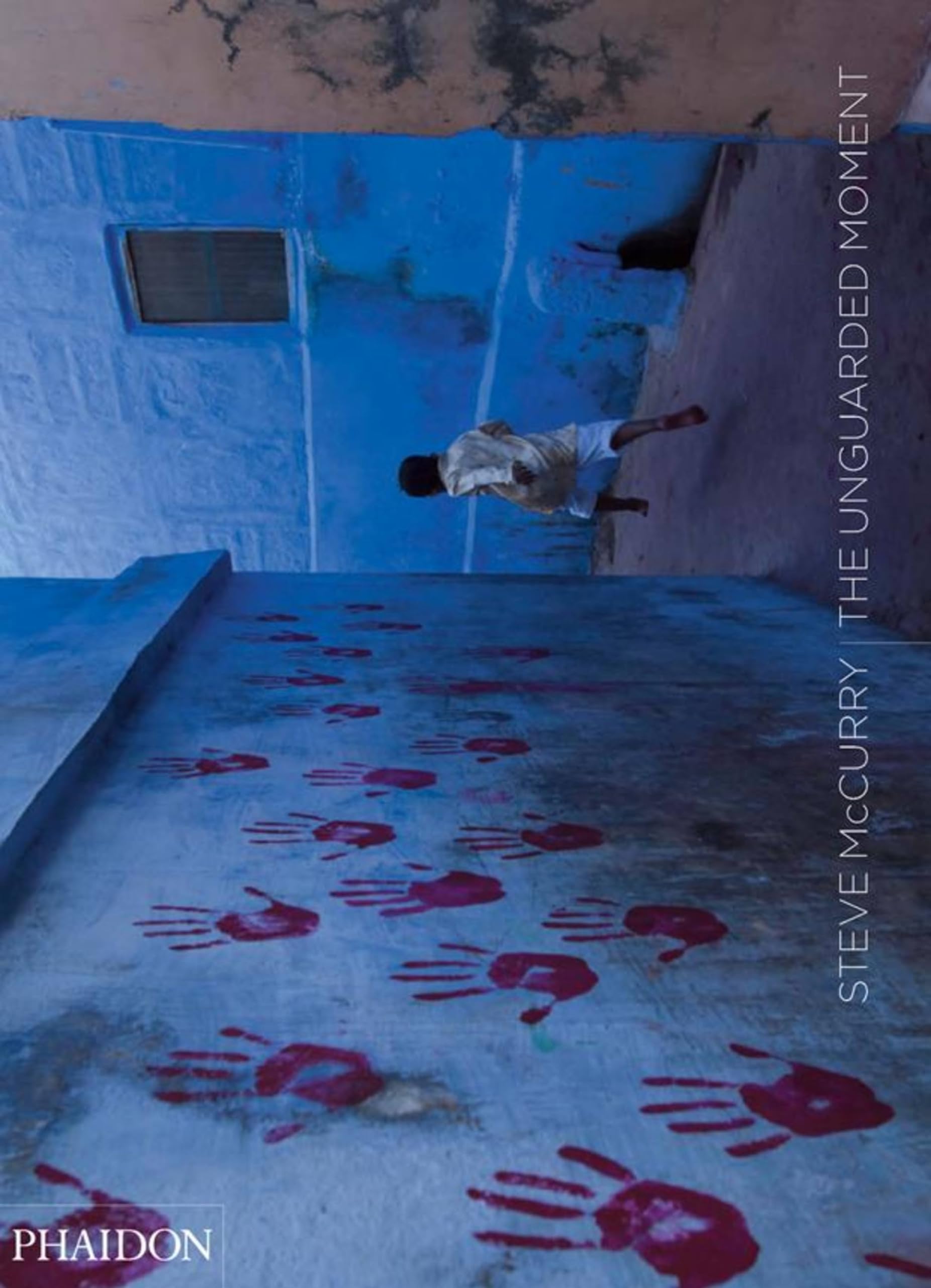 Steve McCurry: The Unguarded Moment Hardcover – May 23, 2009