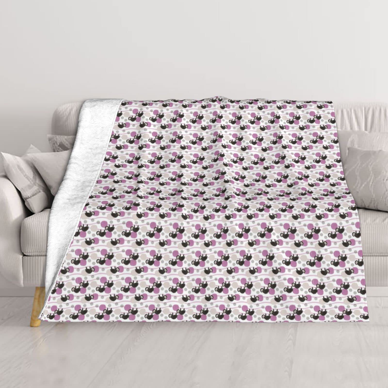 Couverture peluche paresseux contre le froid sur lit et canapé