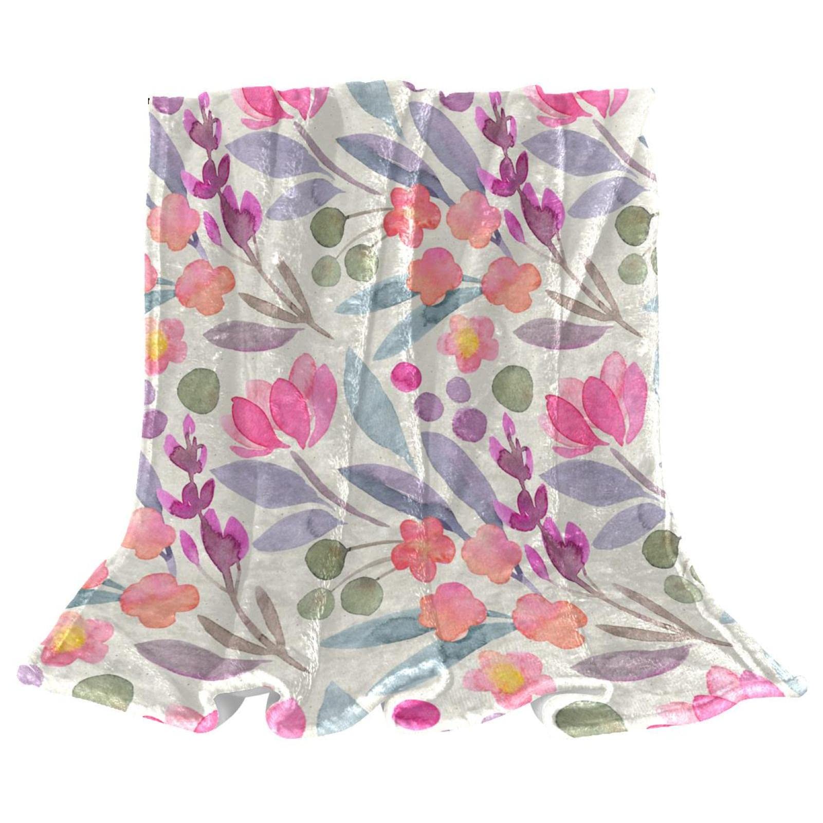 Couvertures polaires fleurs pour soirées cocooning sur canapé