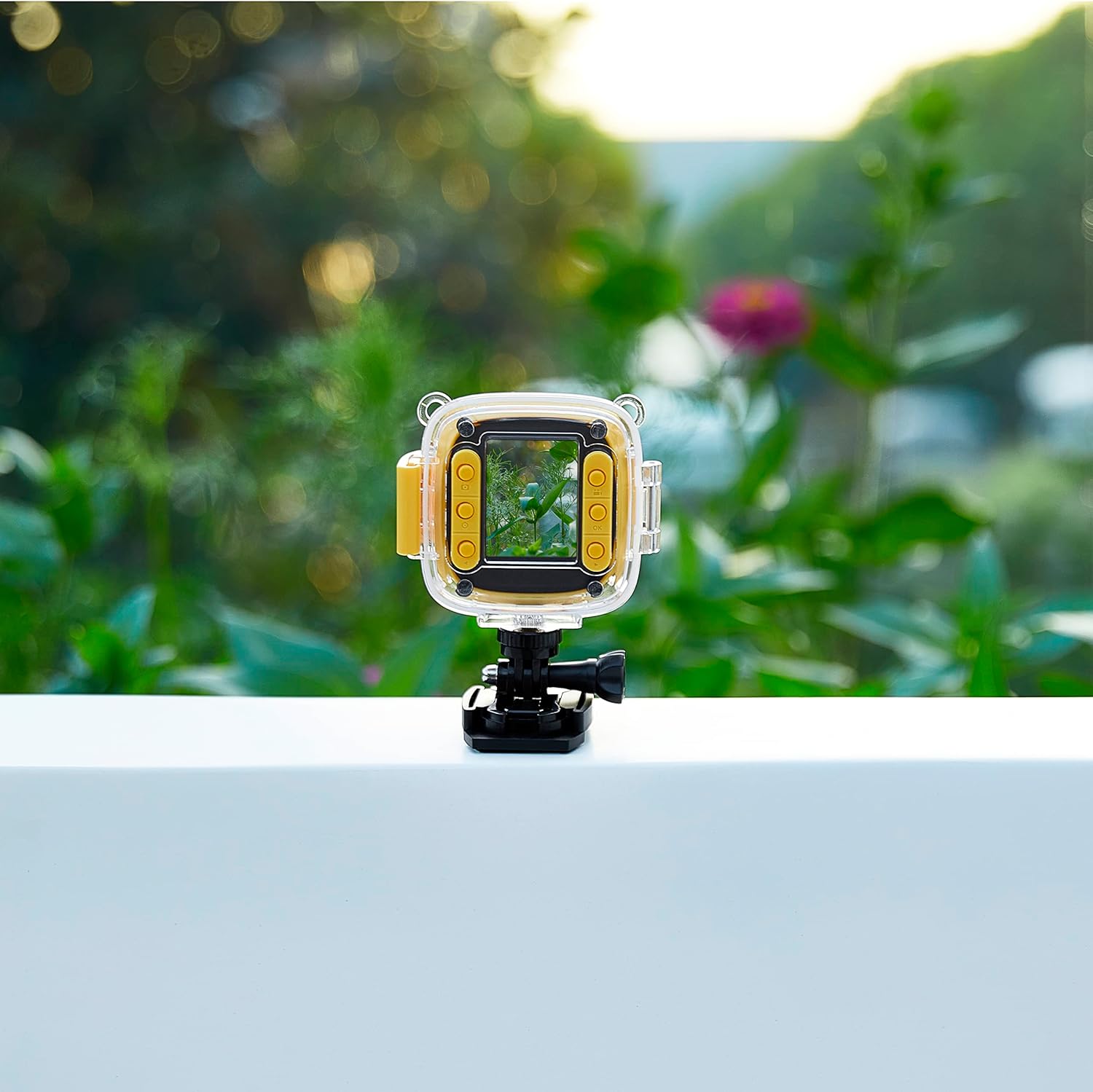 Vivitar Kids Tech Action Camera mounted on a railing, displaying a vibrant image on its screen.