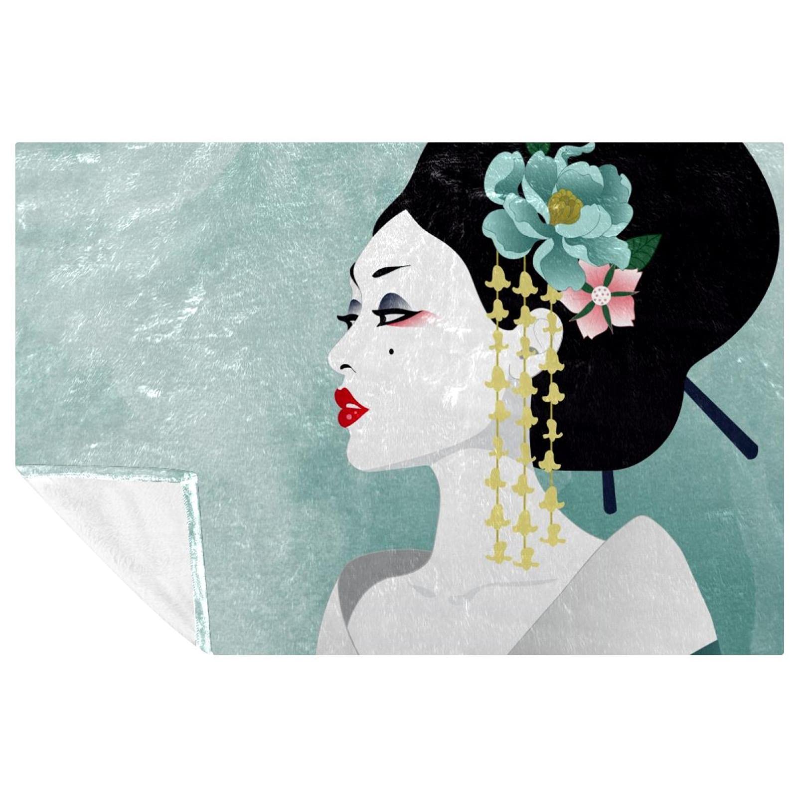 Couverture geisha bleu aquarelle pour stopper le froid sur le canapé et en camping