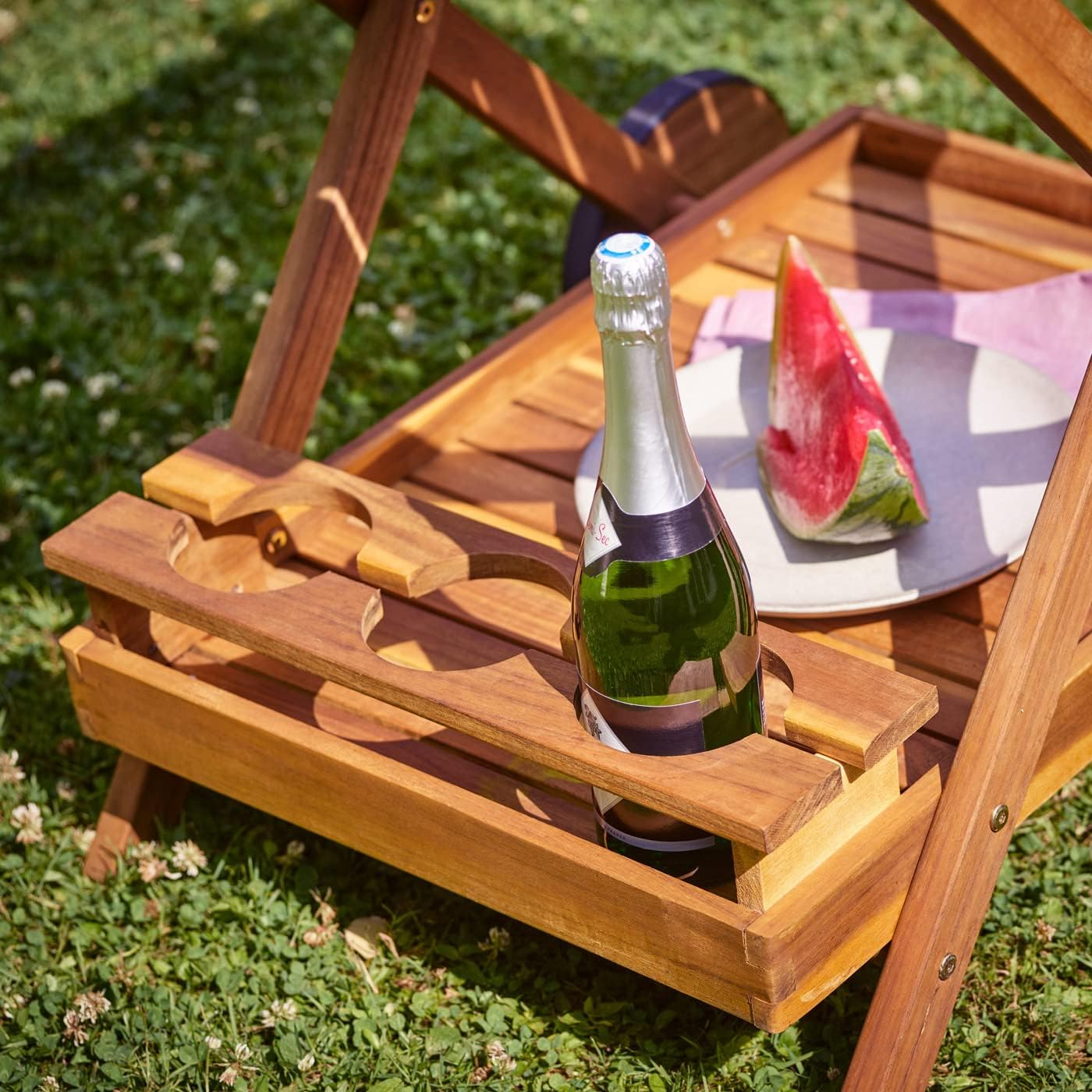 Close-up of the three bottle holders on the lower shelf