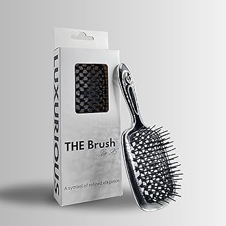 THE Brush hairbrush is your ultimate luxury detangling superbrush, available in chrome gold and silver. With versatile bristles for all hair types, wet or dry, this professional tool gently massages
