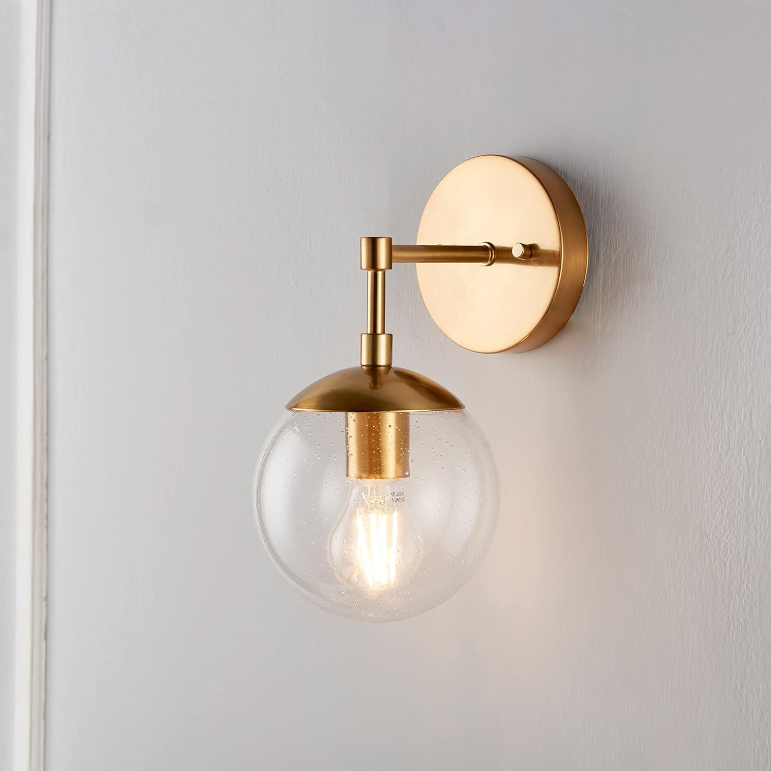 Satin Gold Dimmable Wall Light with Seedy Glass Shade