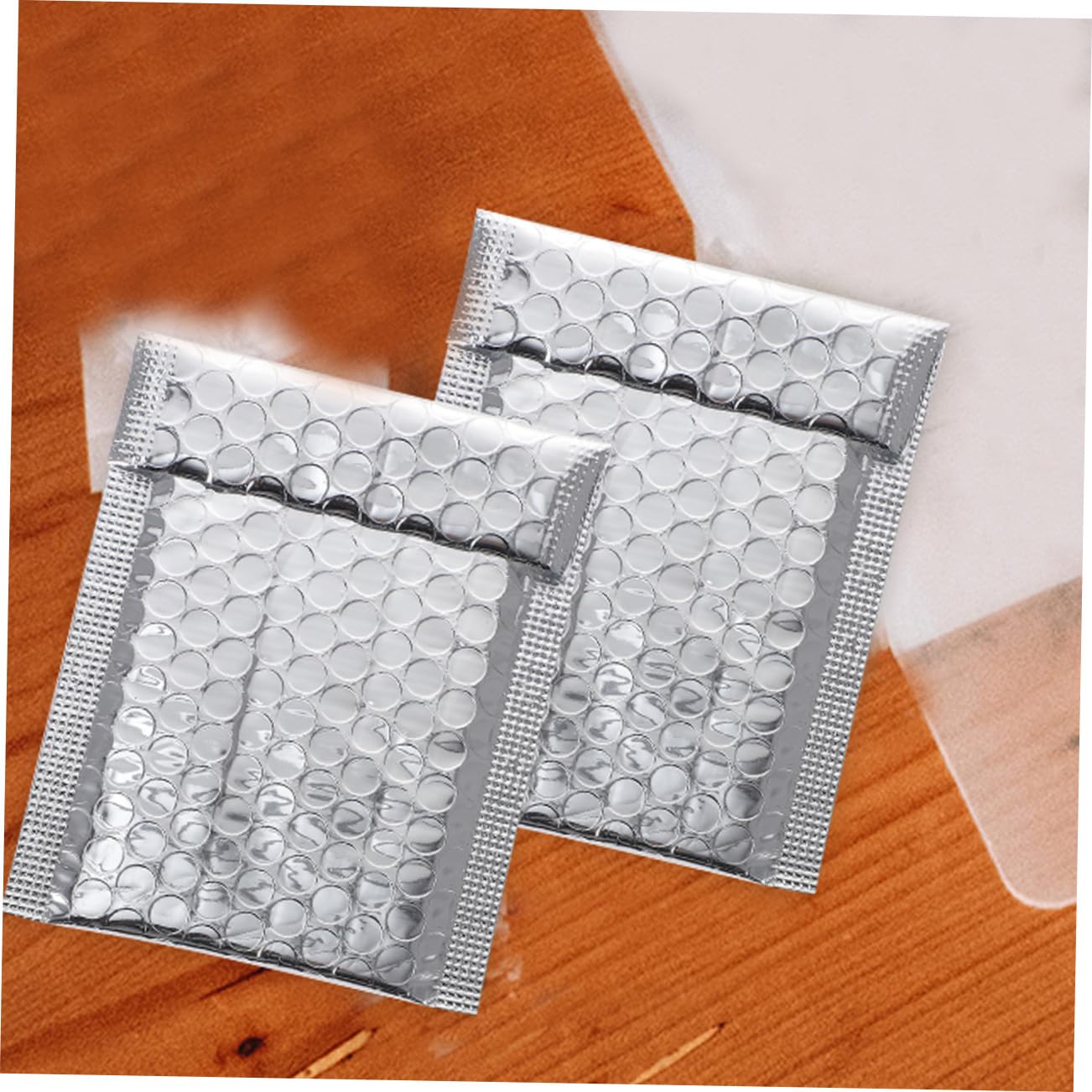 NUOBESTY Sobres Acolchados con Película Metálica Plateada para Envío, Resistentes y Autosellados, Paquete de 100 Unidades para Oficina y Tienda