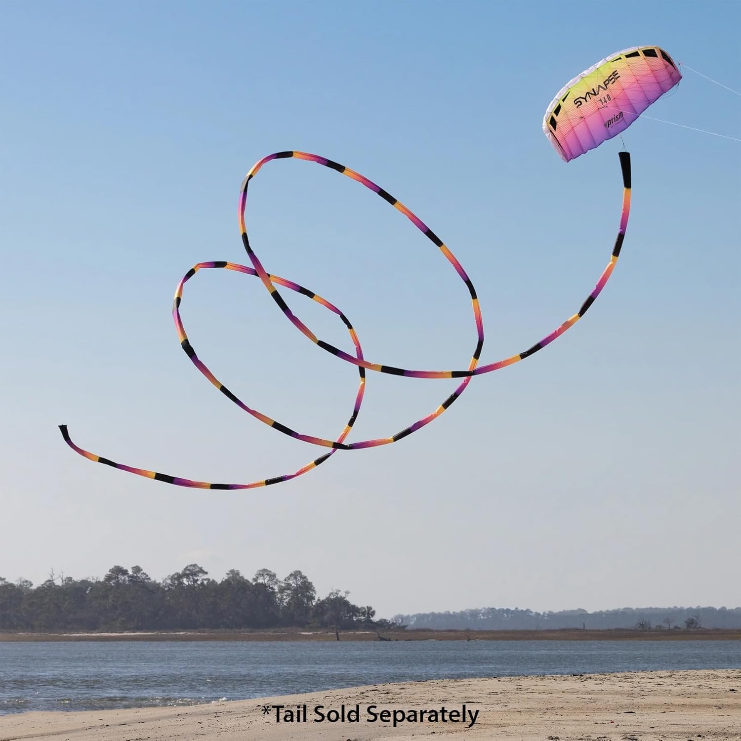 Colorful parafoil kite flying in blue sky
