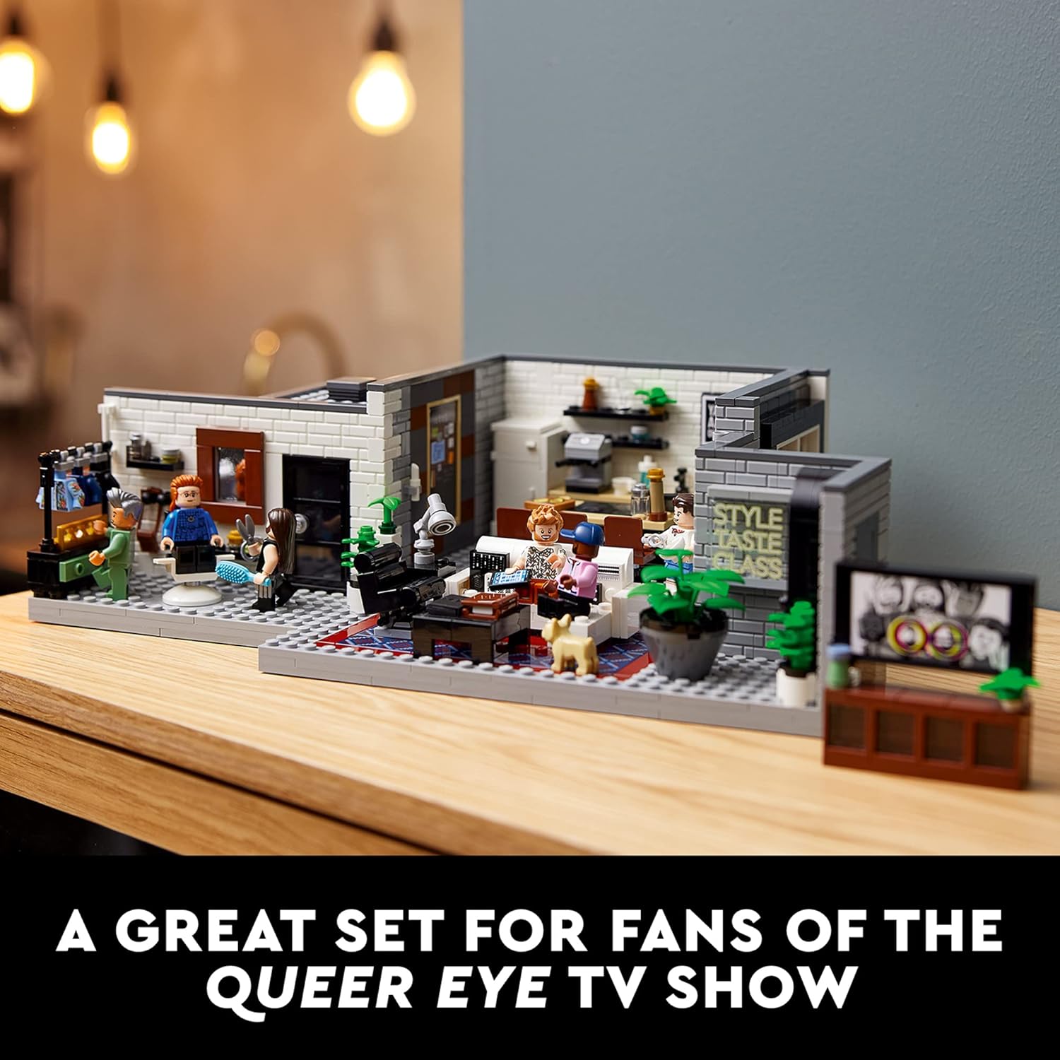 A wide interior shot of the LEGO Queer Eye Fab 5 Loft, displaying the grooming station, living room, and kitchen areas.