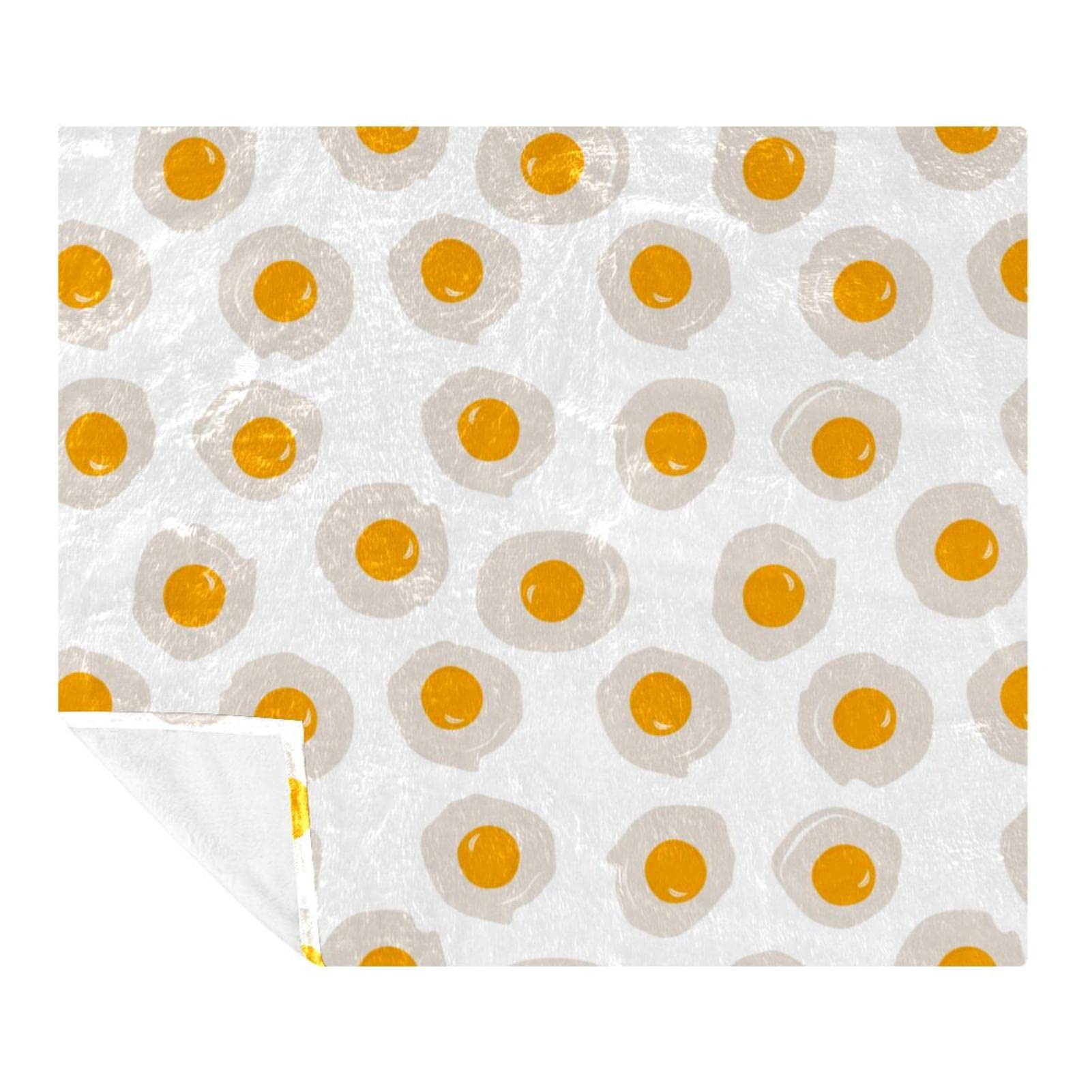 Couverture polaire oeuf poché pour réchauffer vos soirées canapé