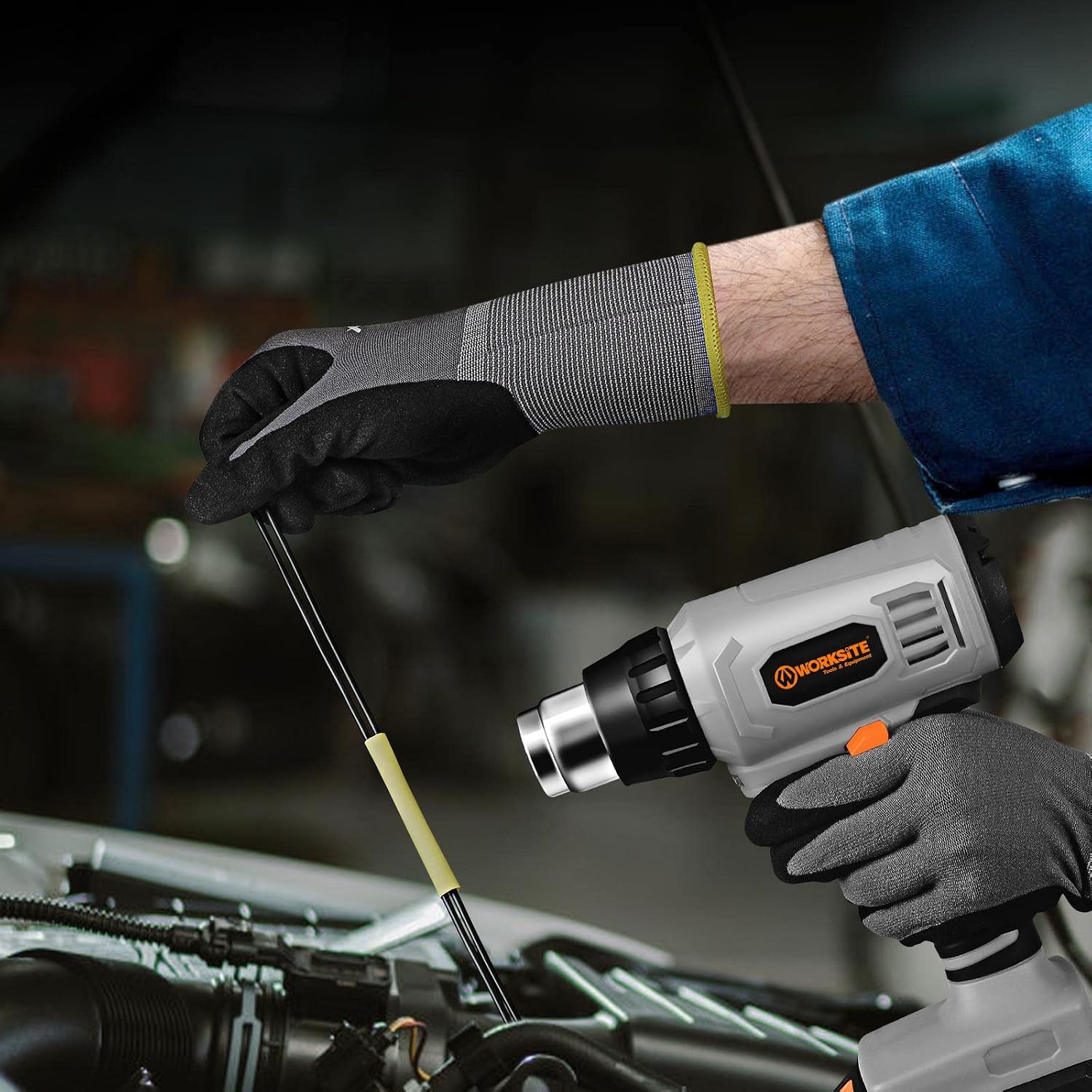 WORKSITE heat gun stripping paint from a surface with a scraper