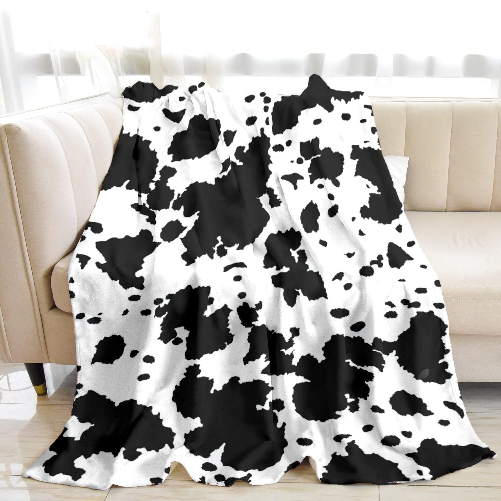 Couverture en flanelle au motif vache avec finitions haut de gamme