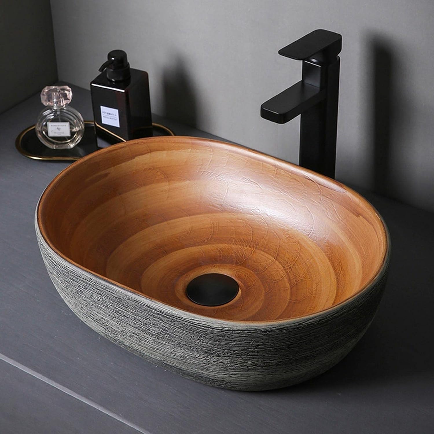 Nowoczesny owalny zlew ceramiczny – umywalka łazienkowa nad blatem, stylowa toaletka na blat do współczesnych przestrzeni i łatwa do czyszczenia