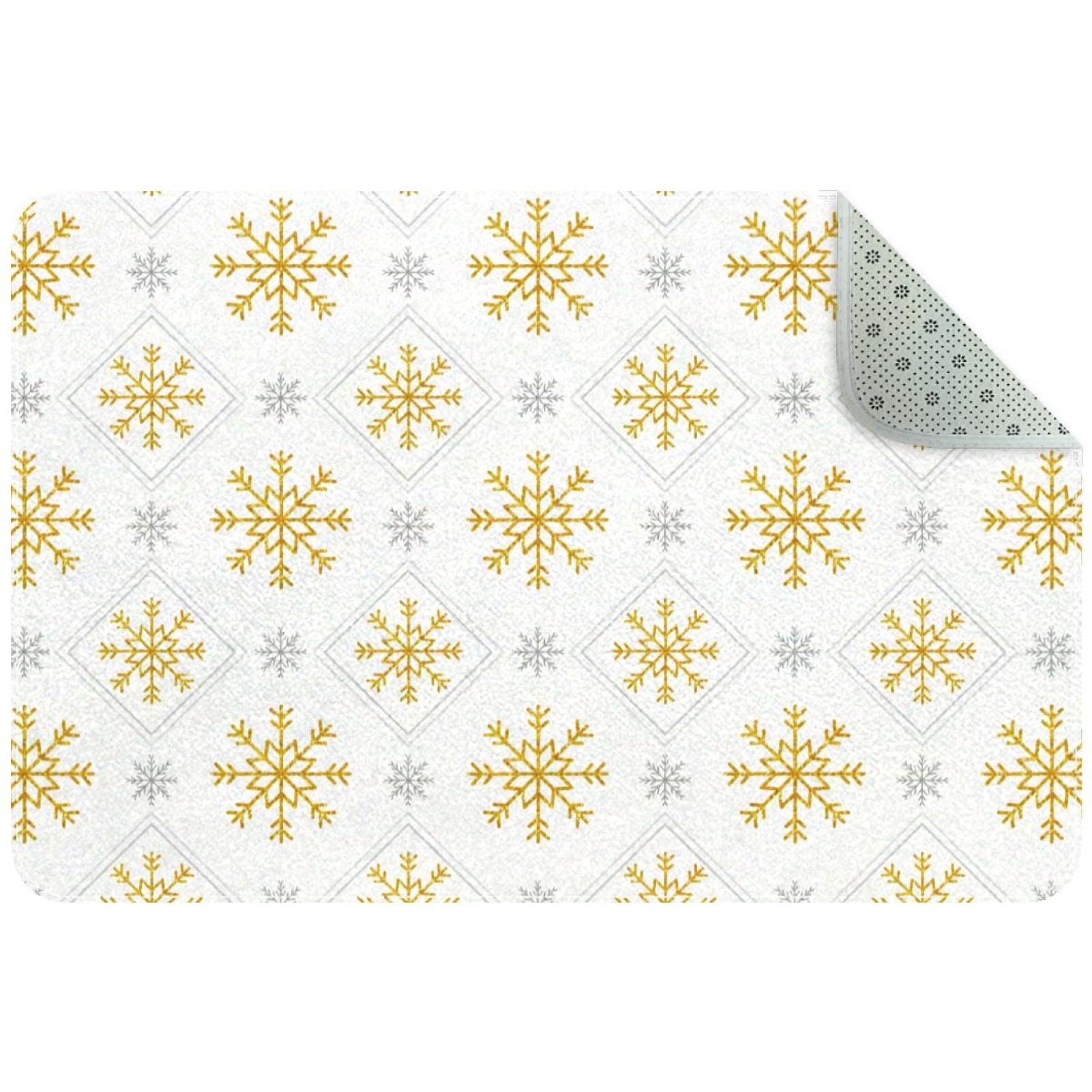 Felpudo de interior navideño y elegante con copos dorados para dar la bienvenida en tu hogar