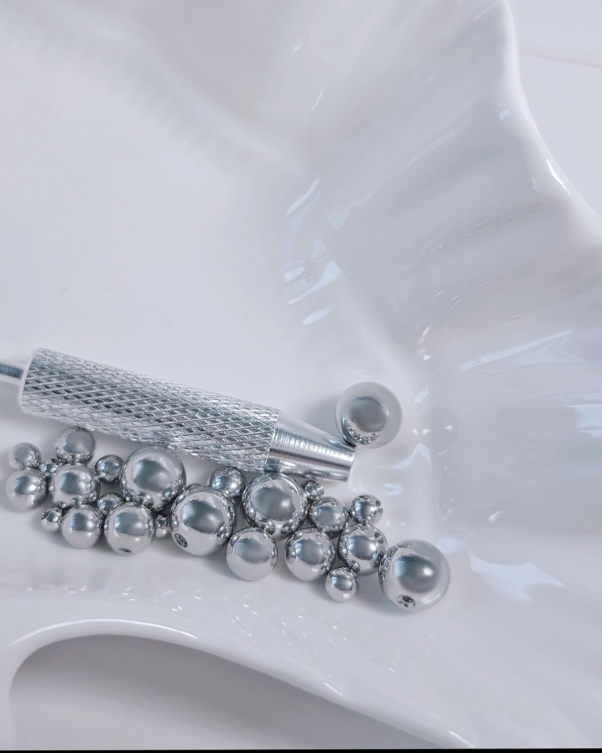External Replacement Piercing Balls and Piercing Ball Grabber Tool