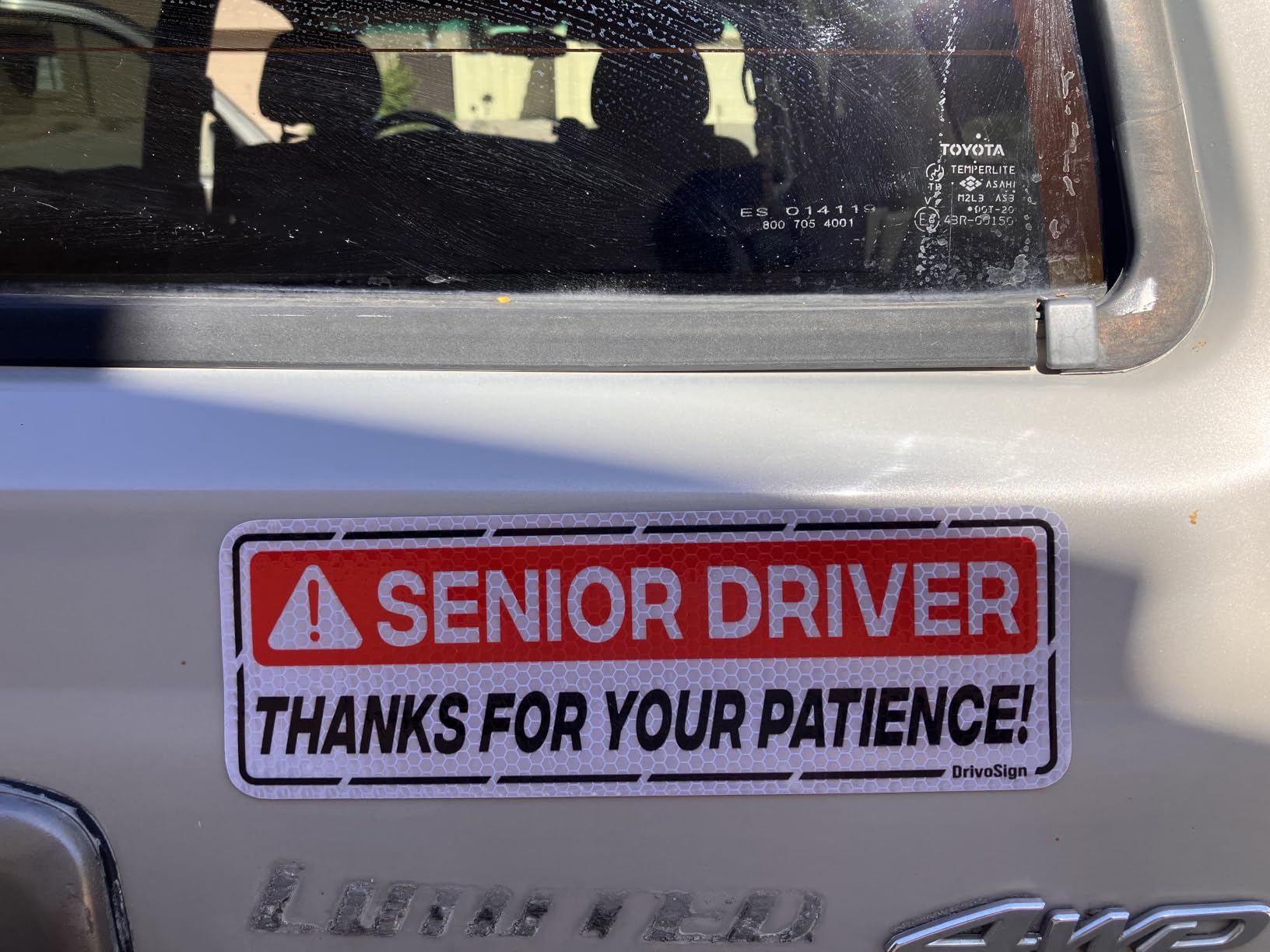 Amazon customer photo of a DrivoSign Senior Driver reflective magnet installed on a vehicle