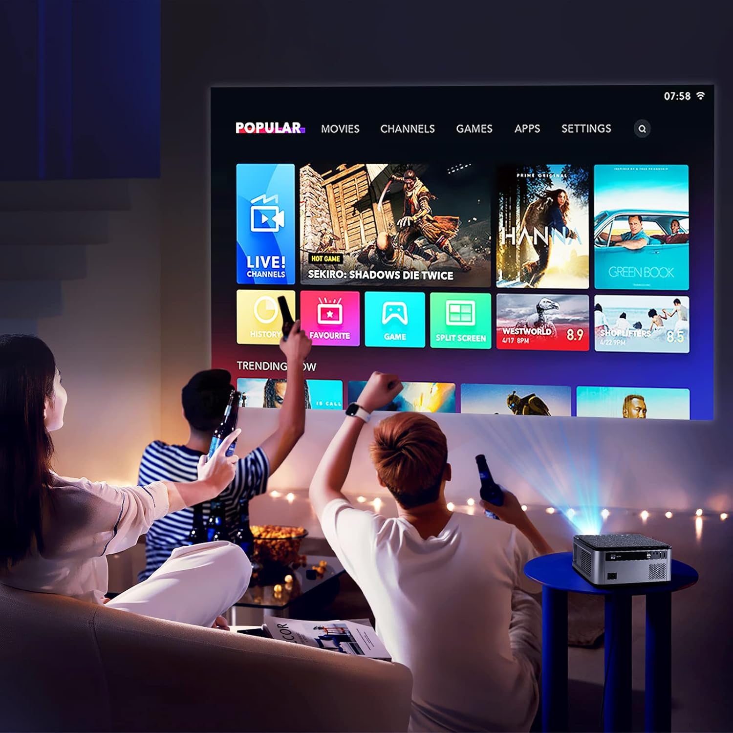 People watching content projected from the VGKE T28 projector, showing a smart TV interface