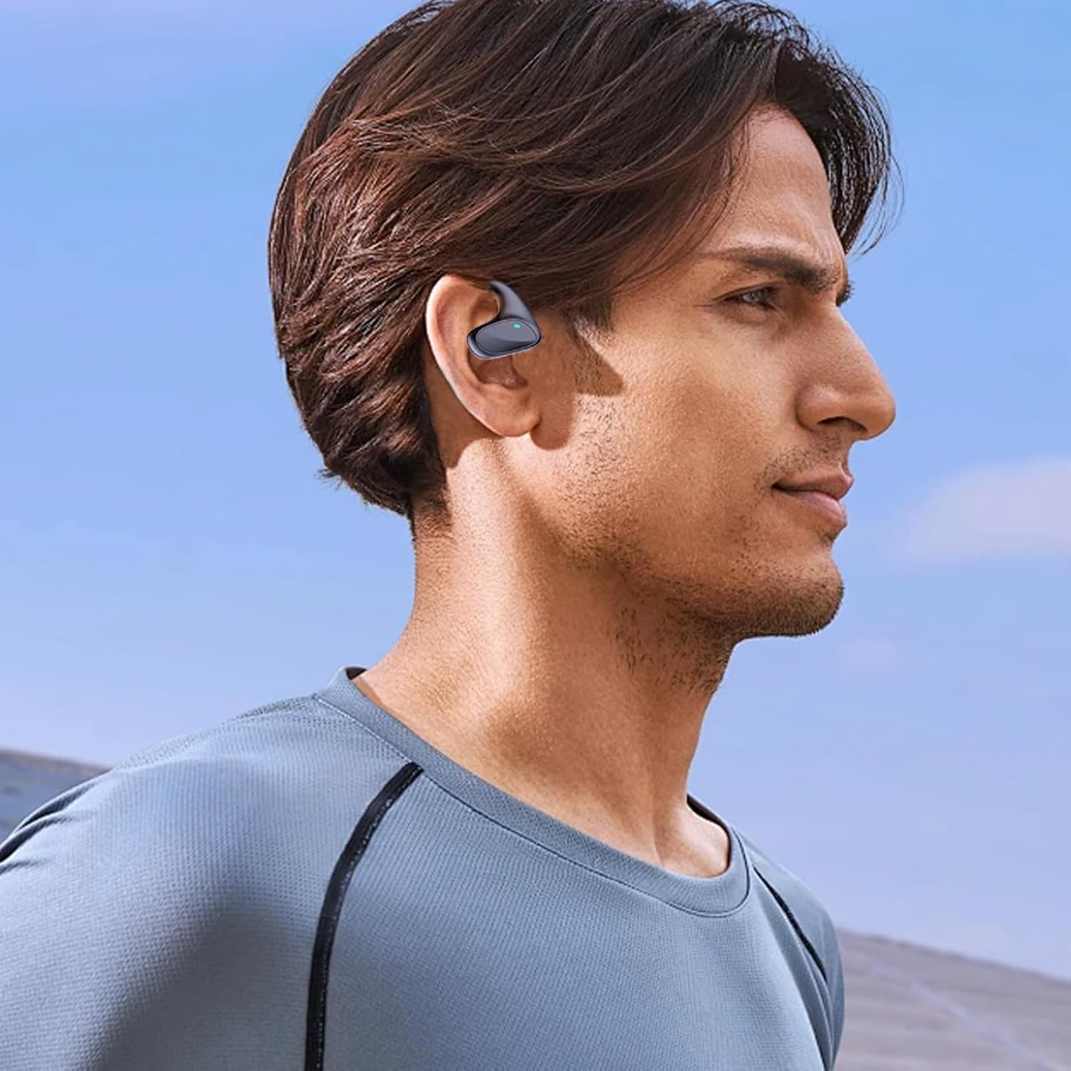 Man wearing the Keilani Talkease earbud translator in his left ear.