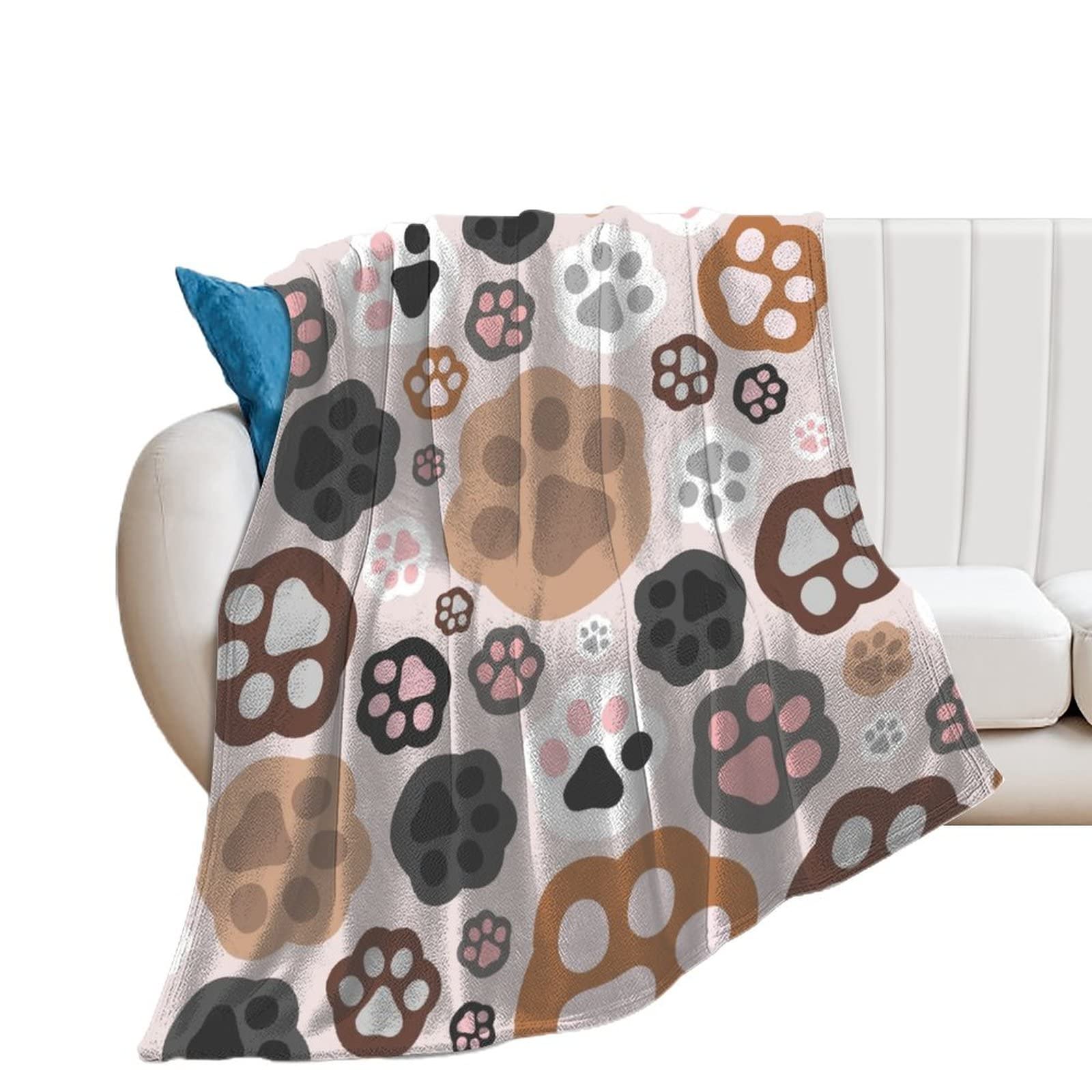 Couverture polaire douce à motifs de pattes pour un canapé cosy et chaleureux