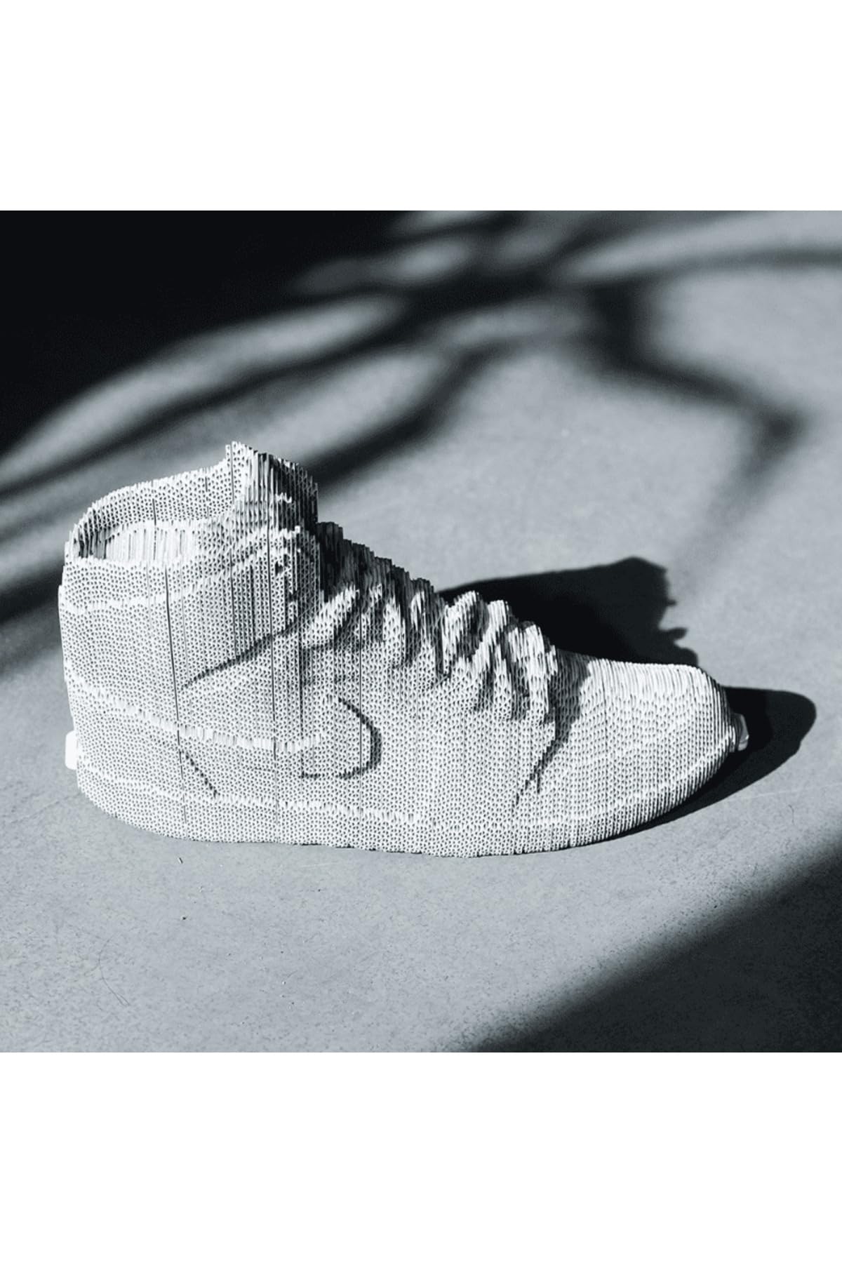 Zapatilla de puzle 3D de cartón reciclado